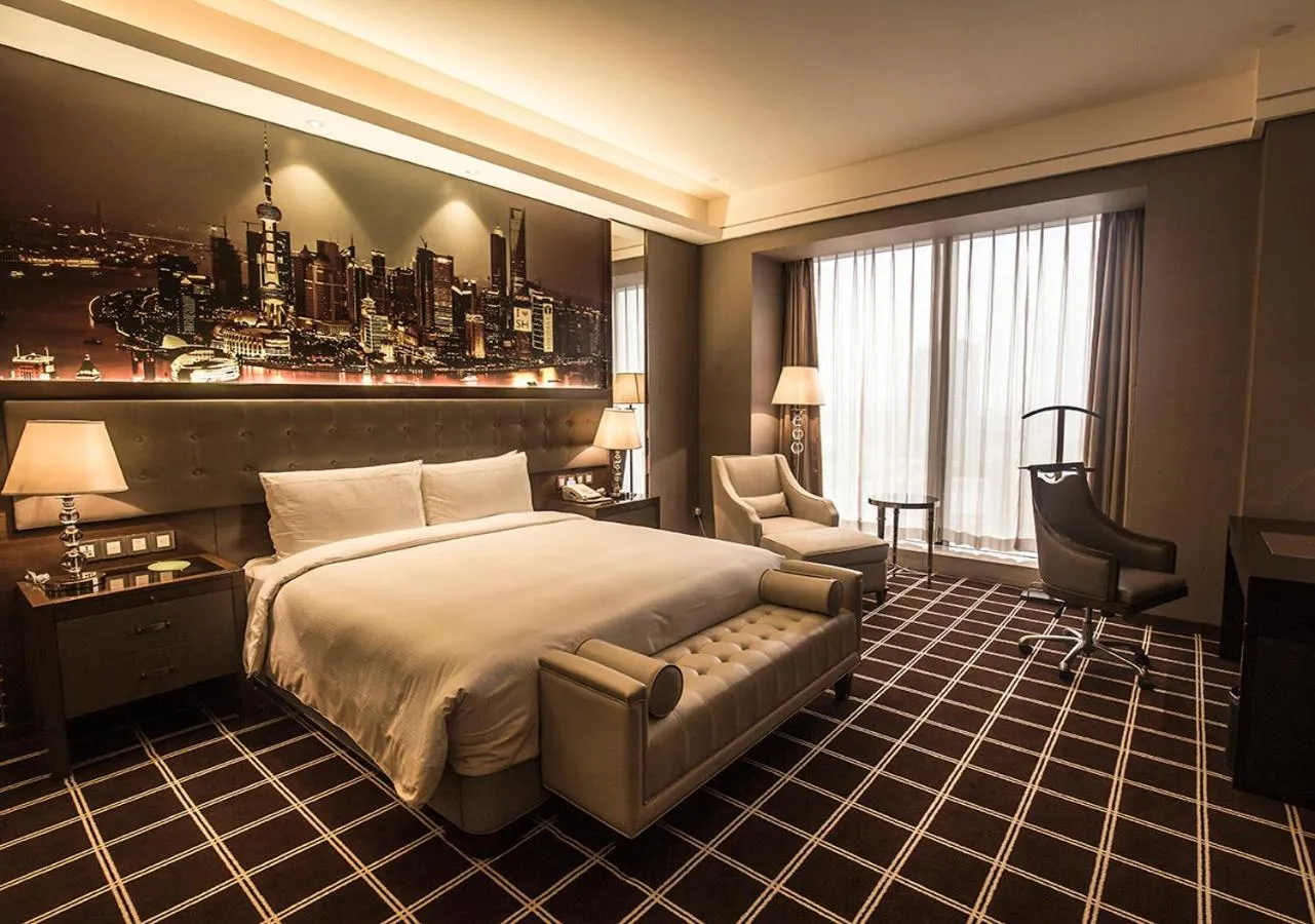 Bed in Royal Century Hotel Shanghai