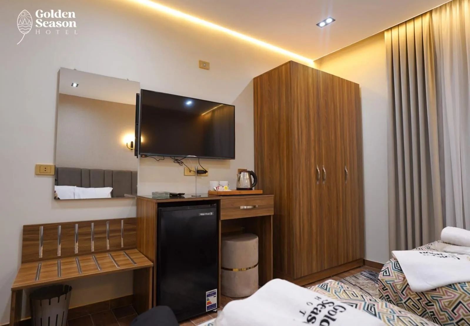 Communal lounge/ TV room, Bed in Golden Season Hotel