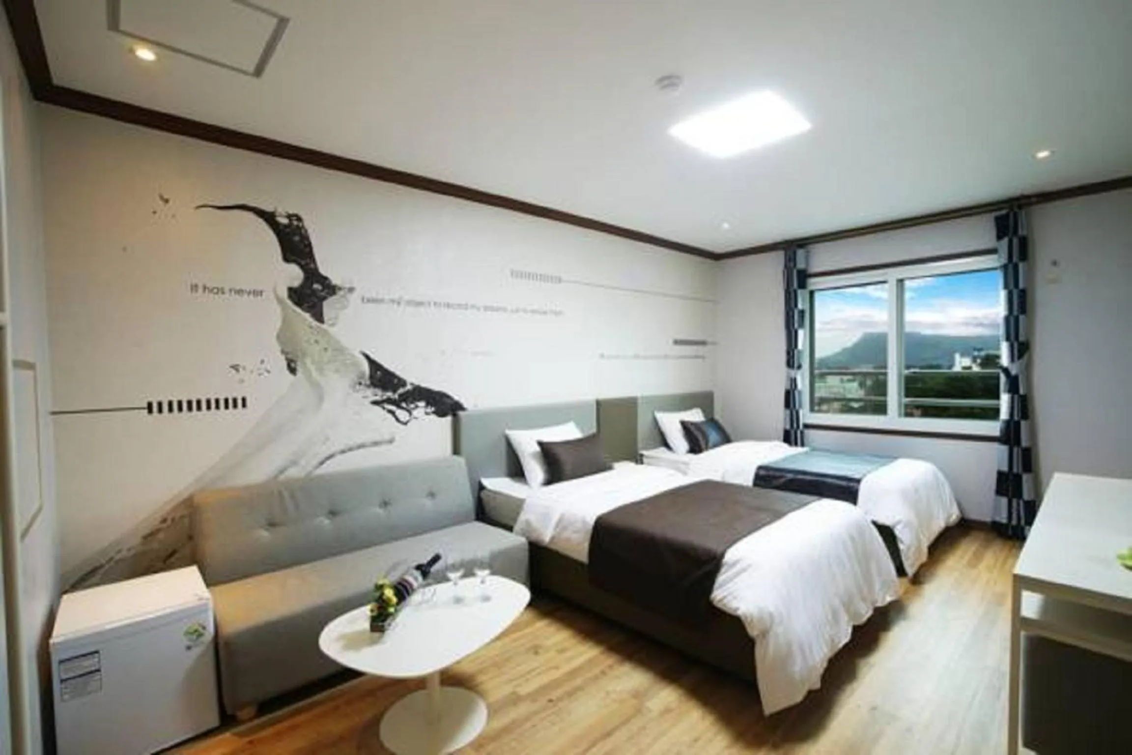 Bed in Seongsan Aqua Beach Hotel