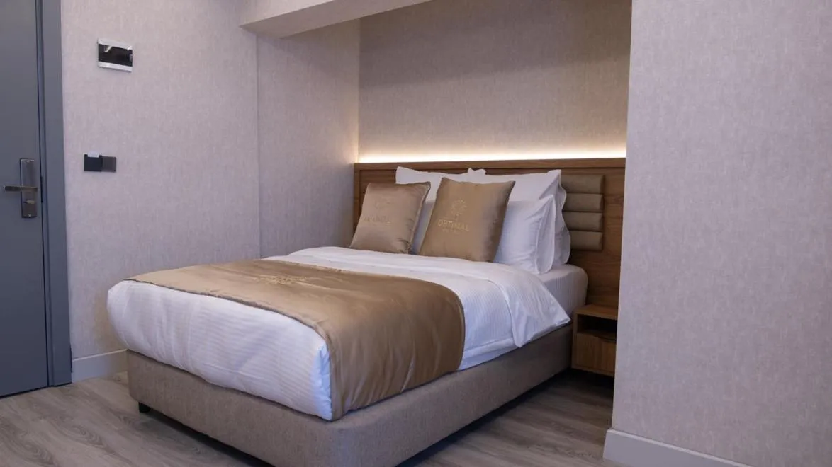 Bed in Optimal Hotel