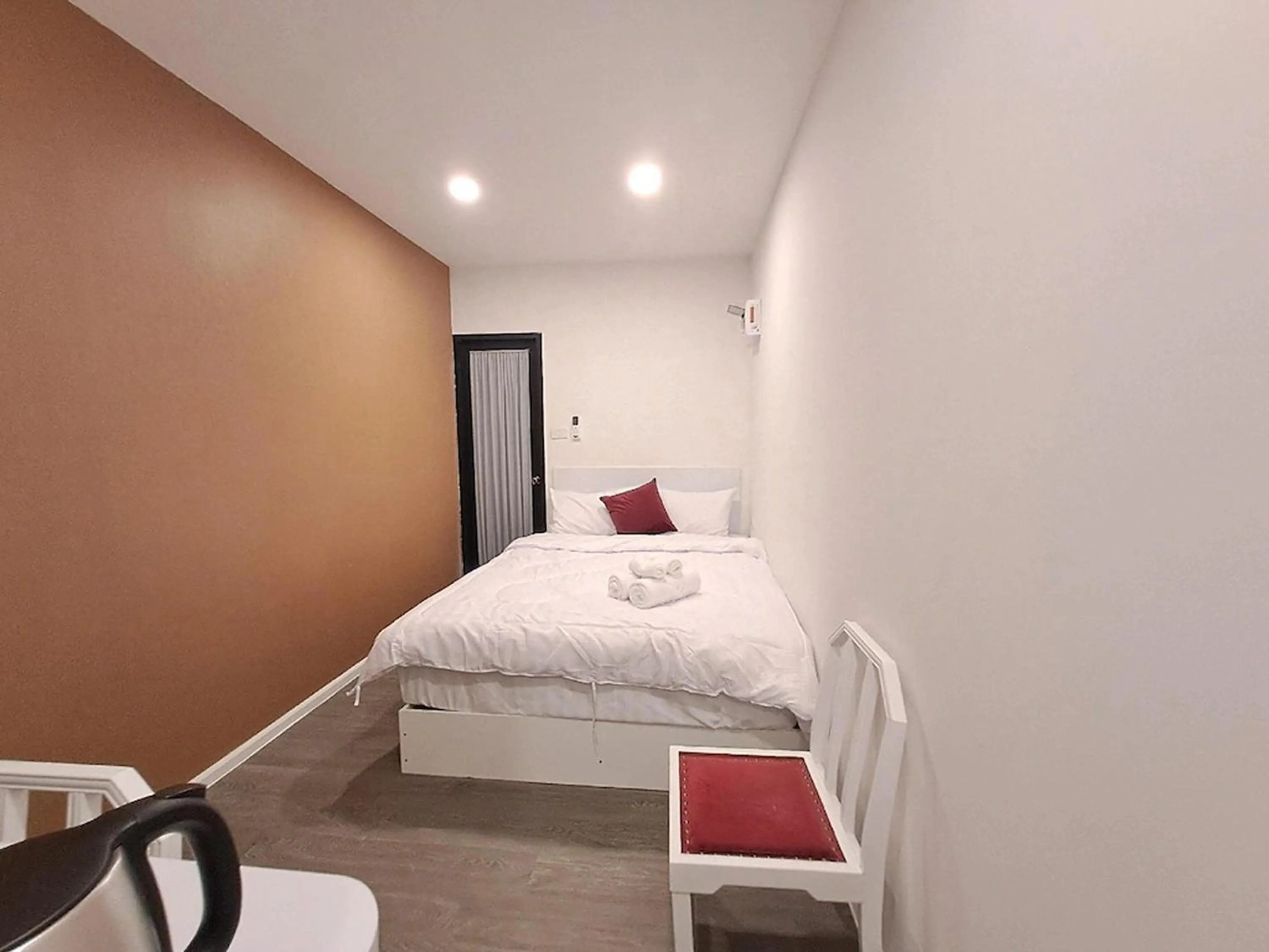 Bed in Nomads Homestay Sriracha