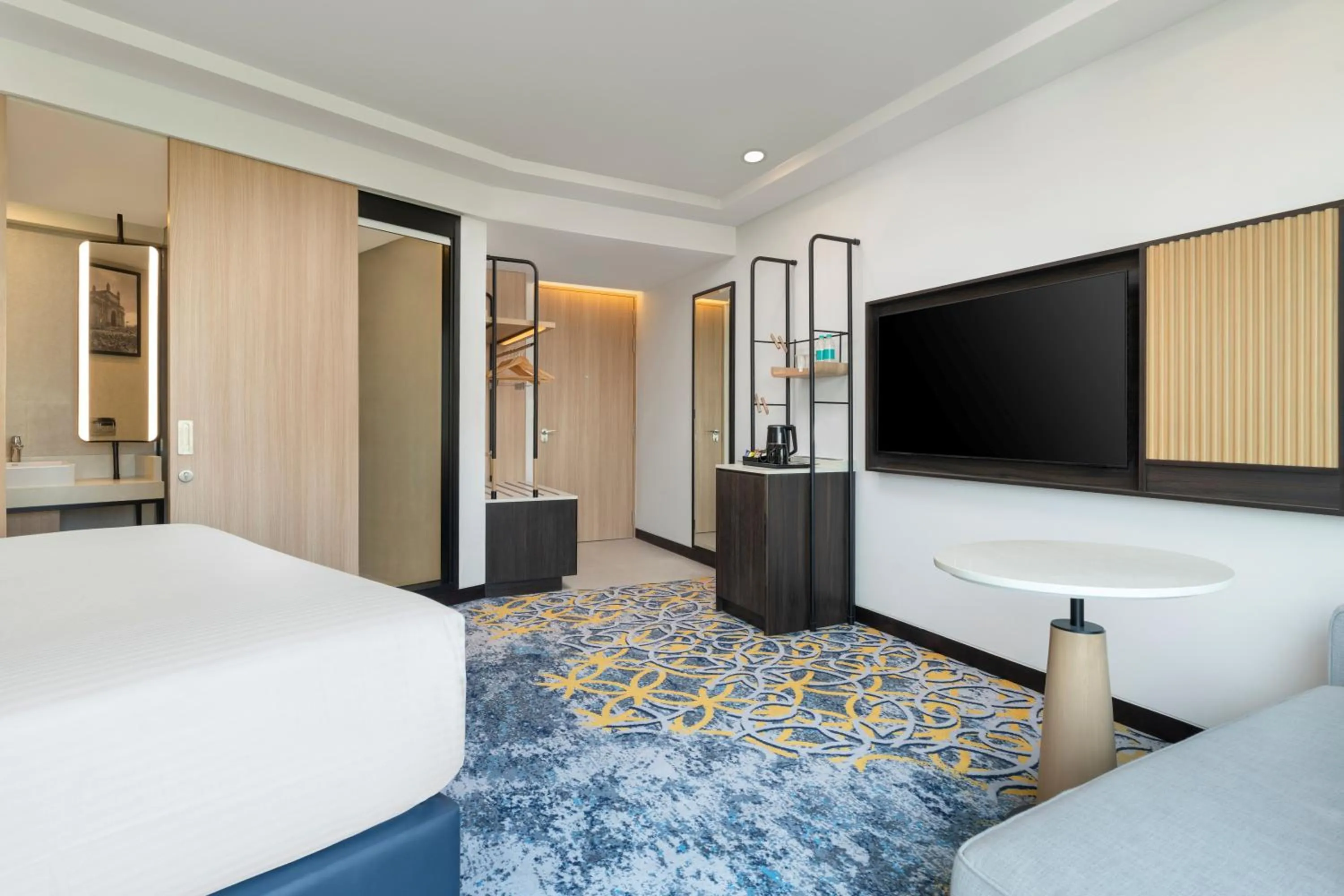 Photo of the whole room, Bed in Hilton Garden Inn Mumbai International Airport