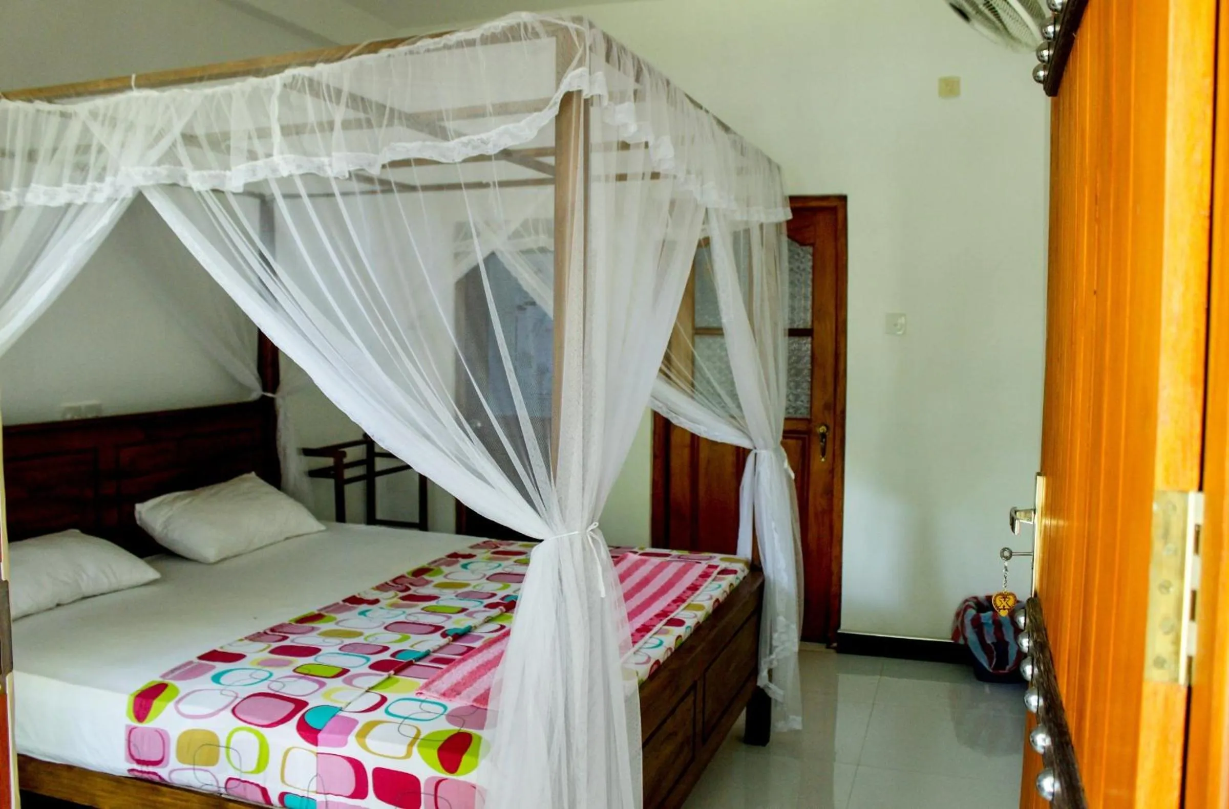 Photo of the whole room, Bed in Orchid Rest