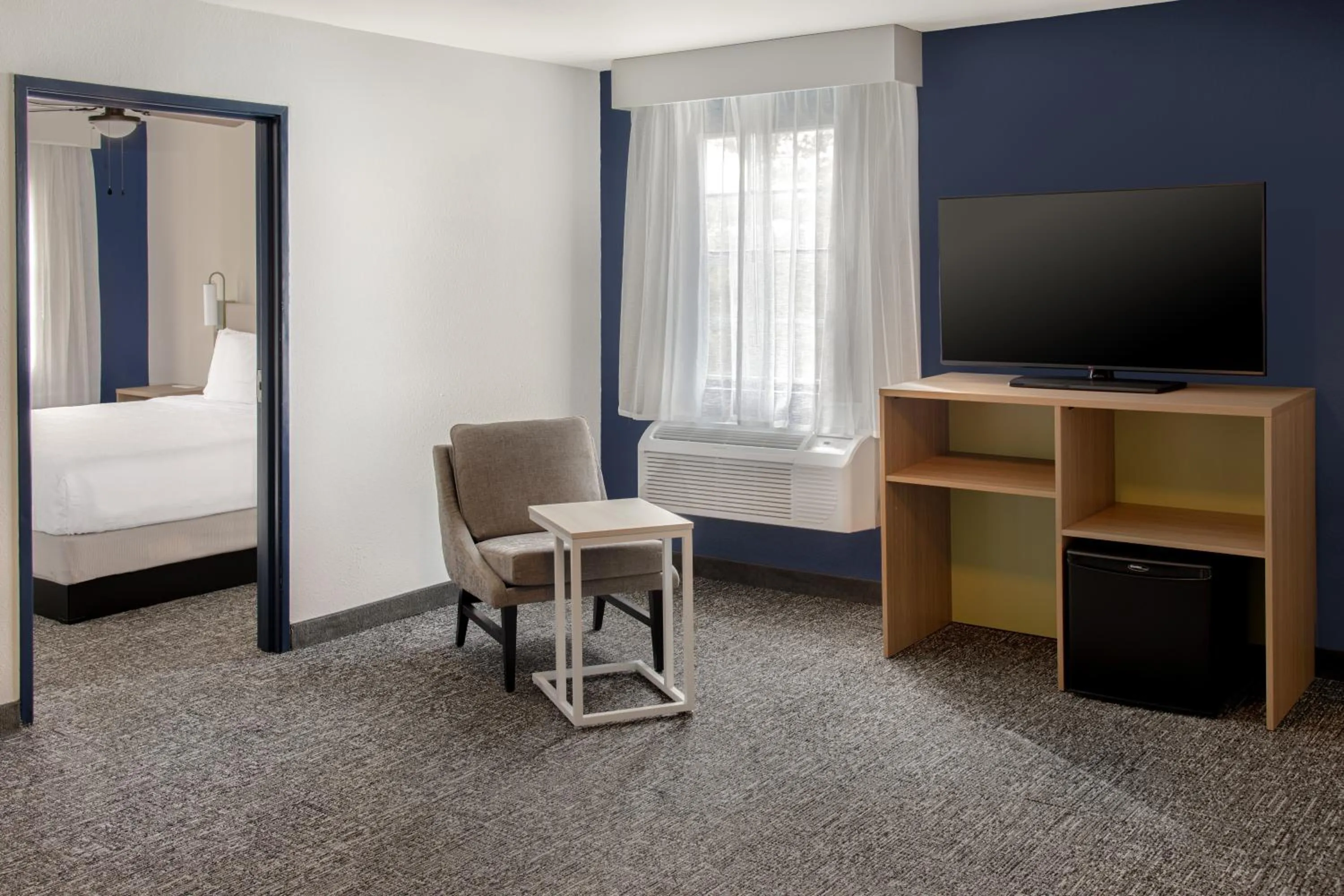 Seating area, Bed in Spark by Hilton St Robert Fort Leonard Wood