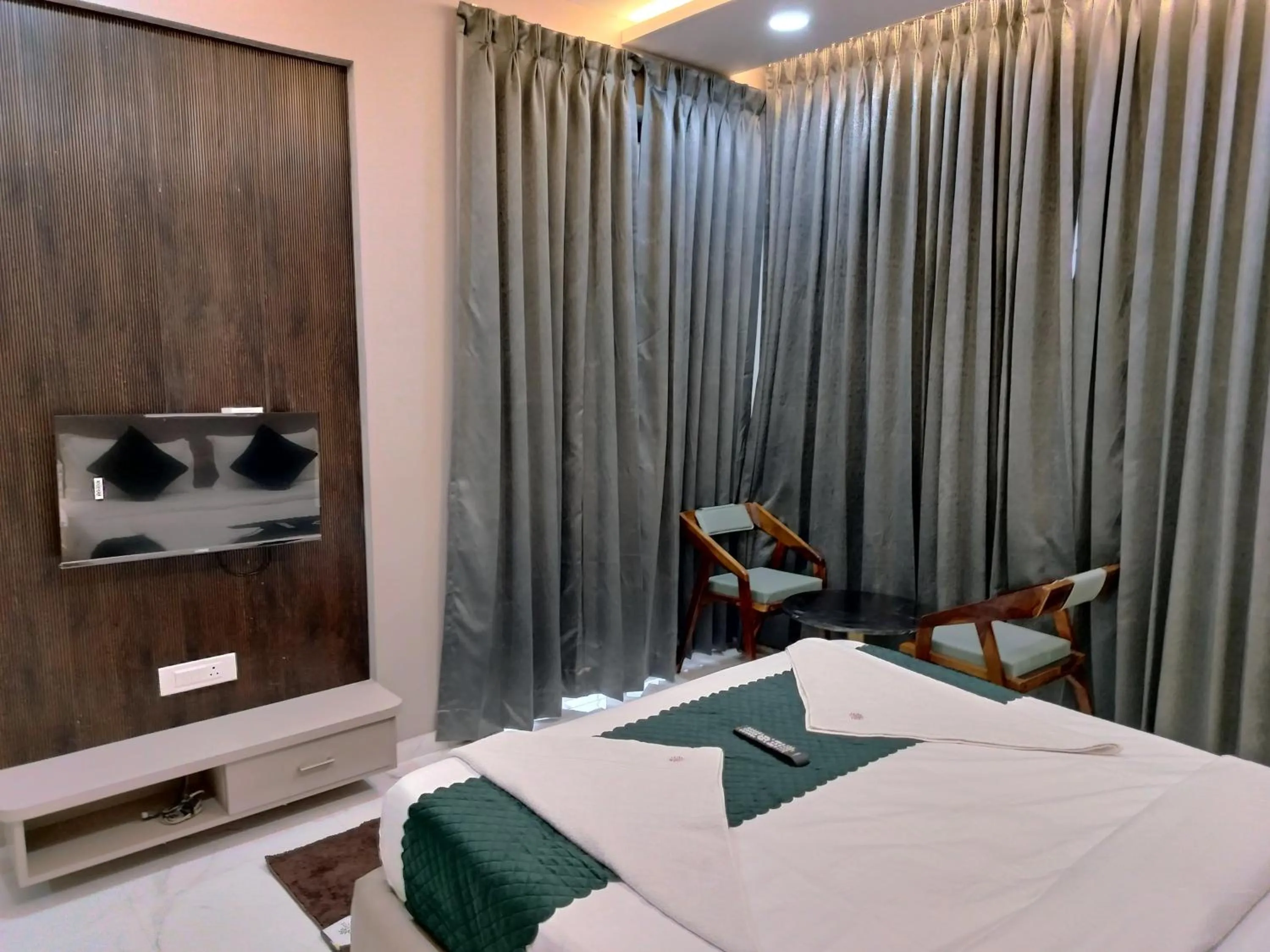 Photo of the whole room, Bed in Hotel Laxmi Elite Karad