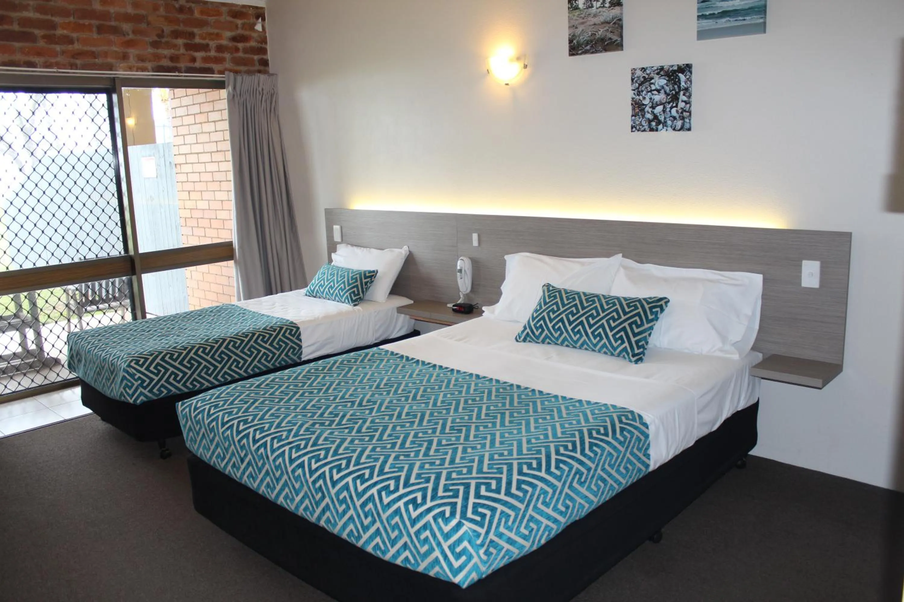 Bed in Sarina Beach Motel