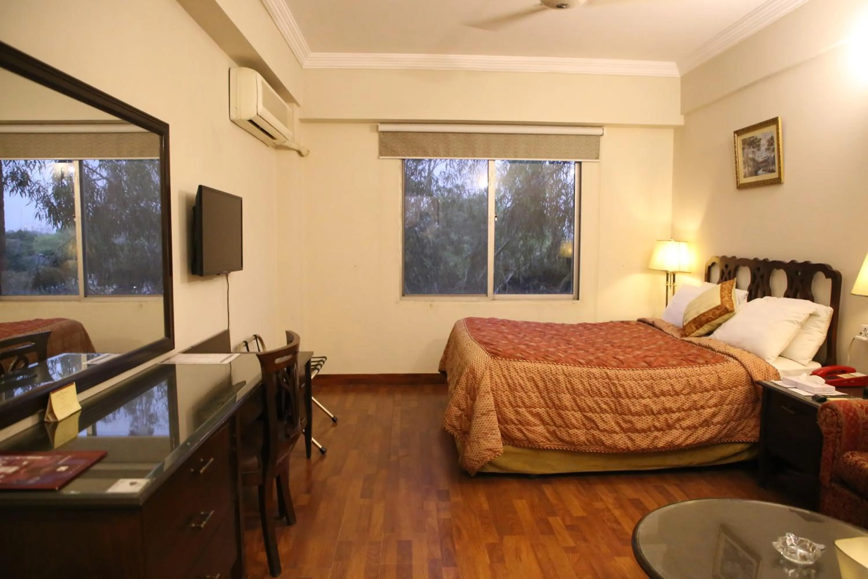 Bed in Carlton Tower Hotel Lahore