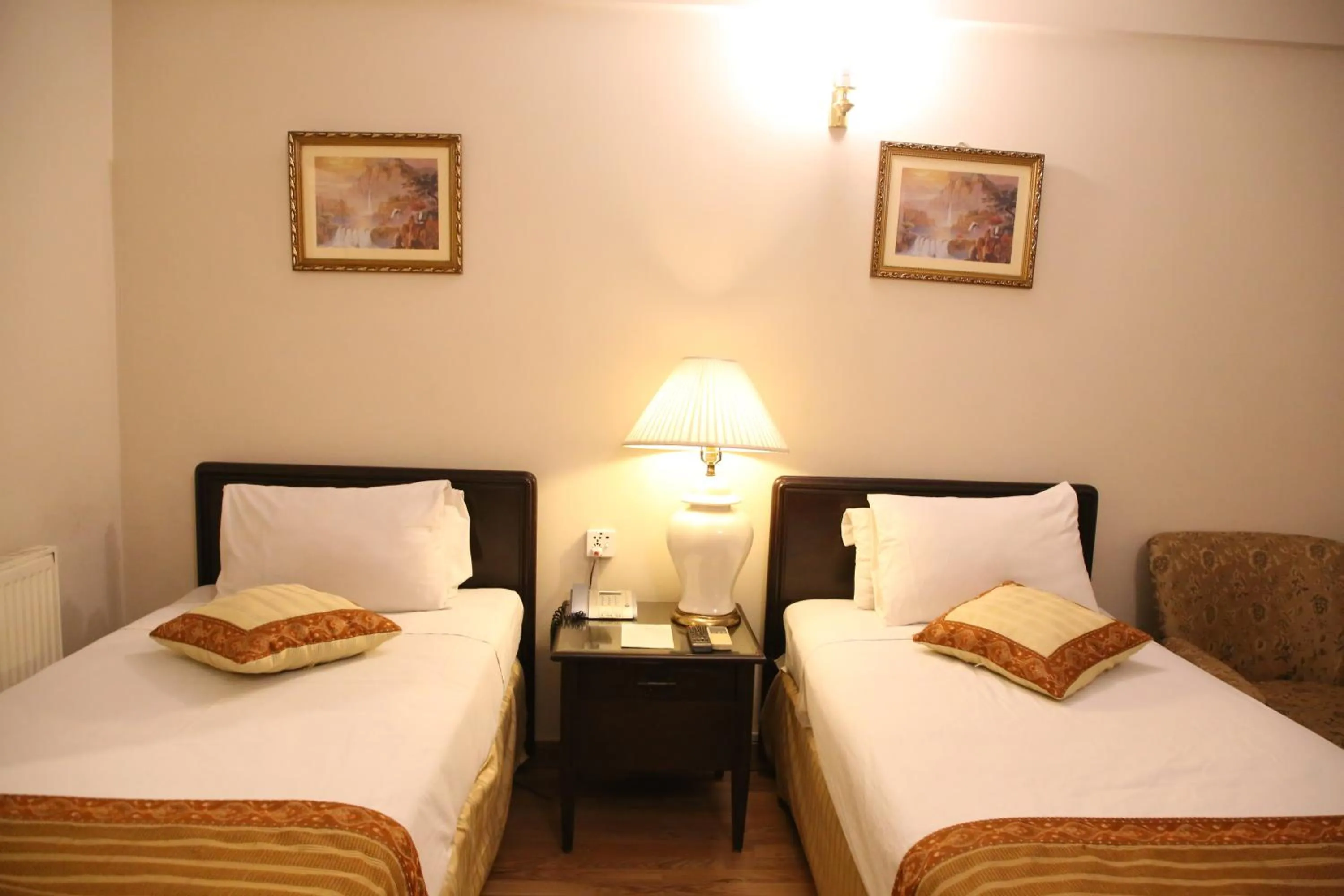 Bed in Carlton Tower Hotel Lahore