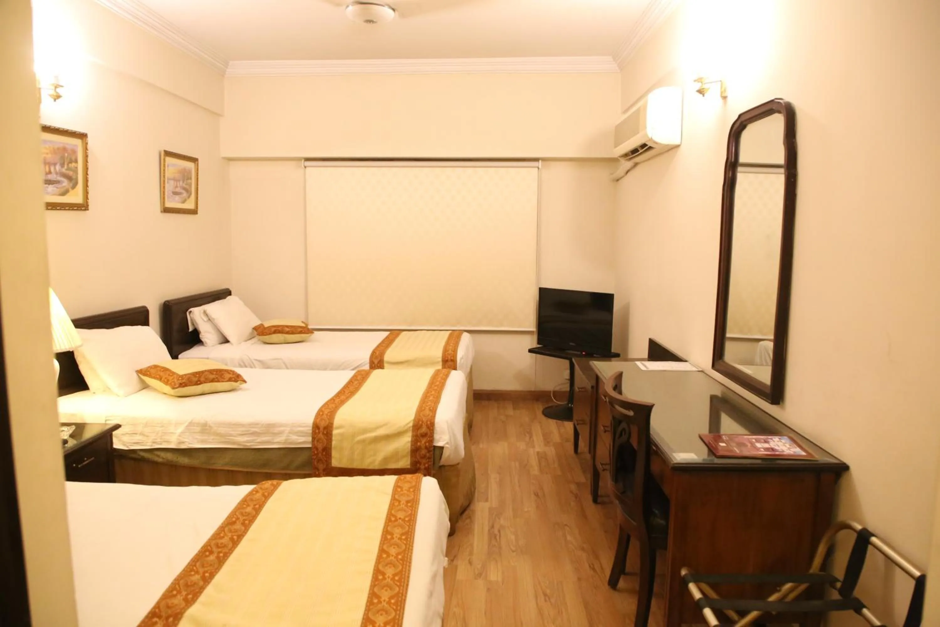 Bed in Carlton Tower Hotel Lahore