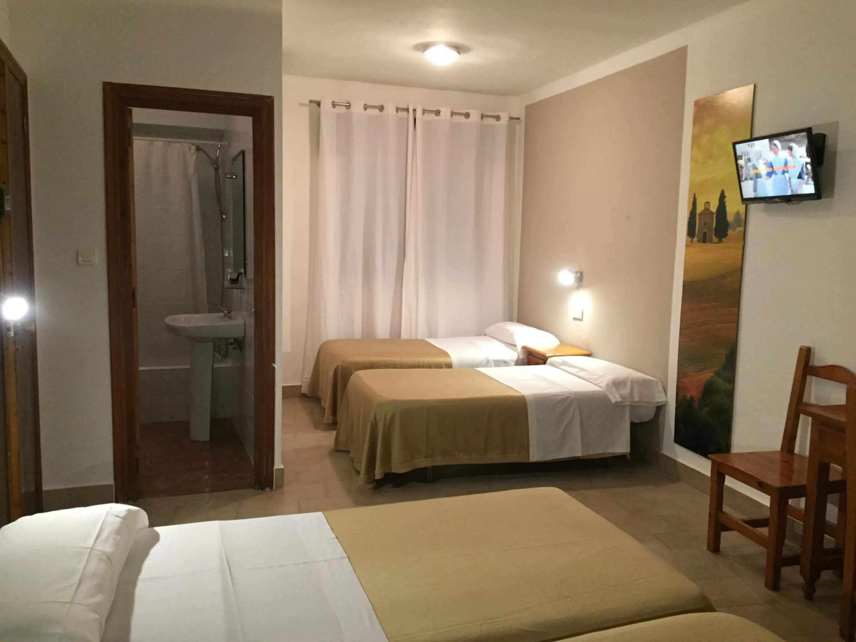 Photo of the whole room, Bed in Hostal Puerto Beach