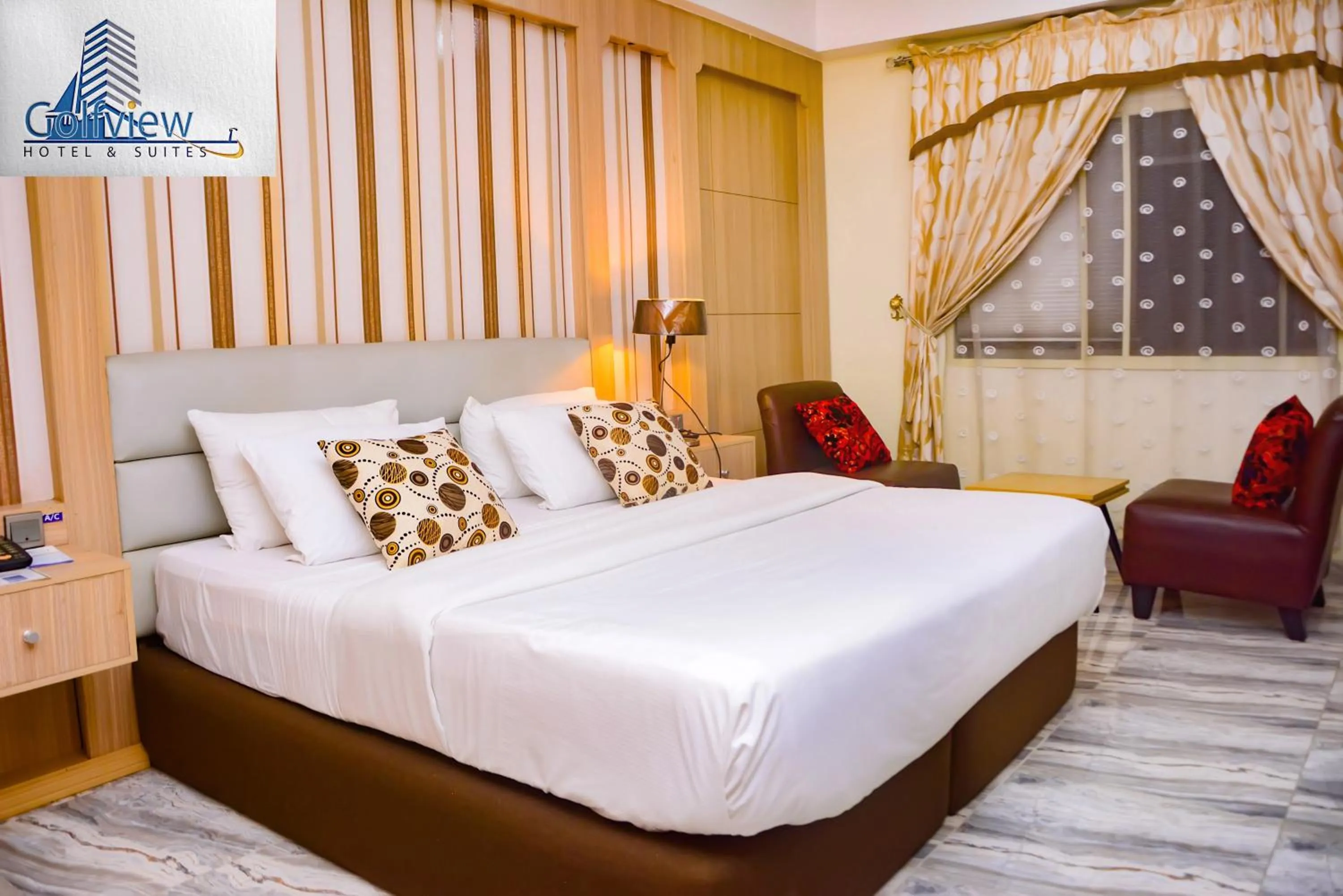 Bed in GolfView Suites & Conference Center