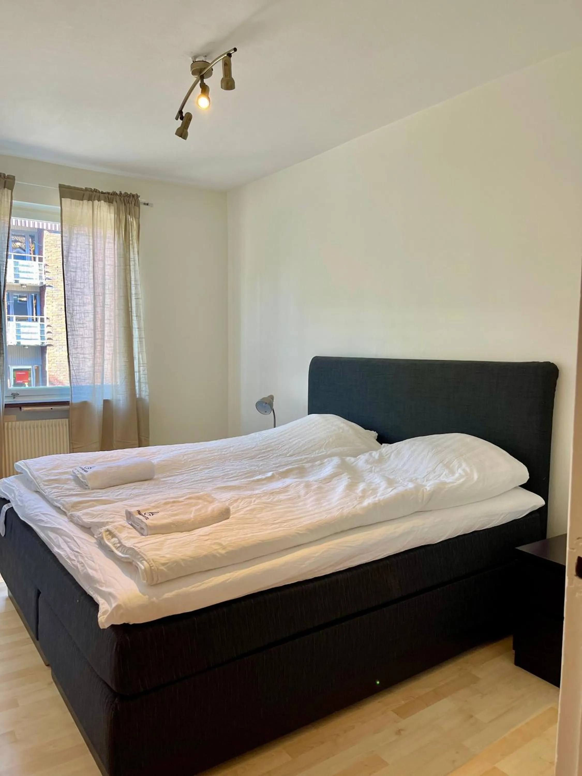 Bed in Säffle Suites by Svaneholm Hotel