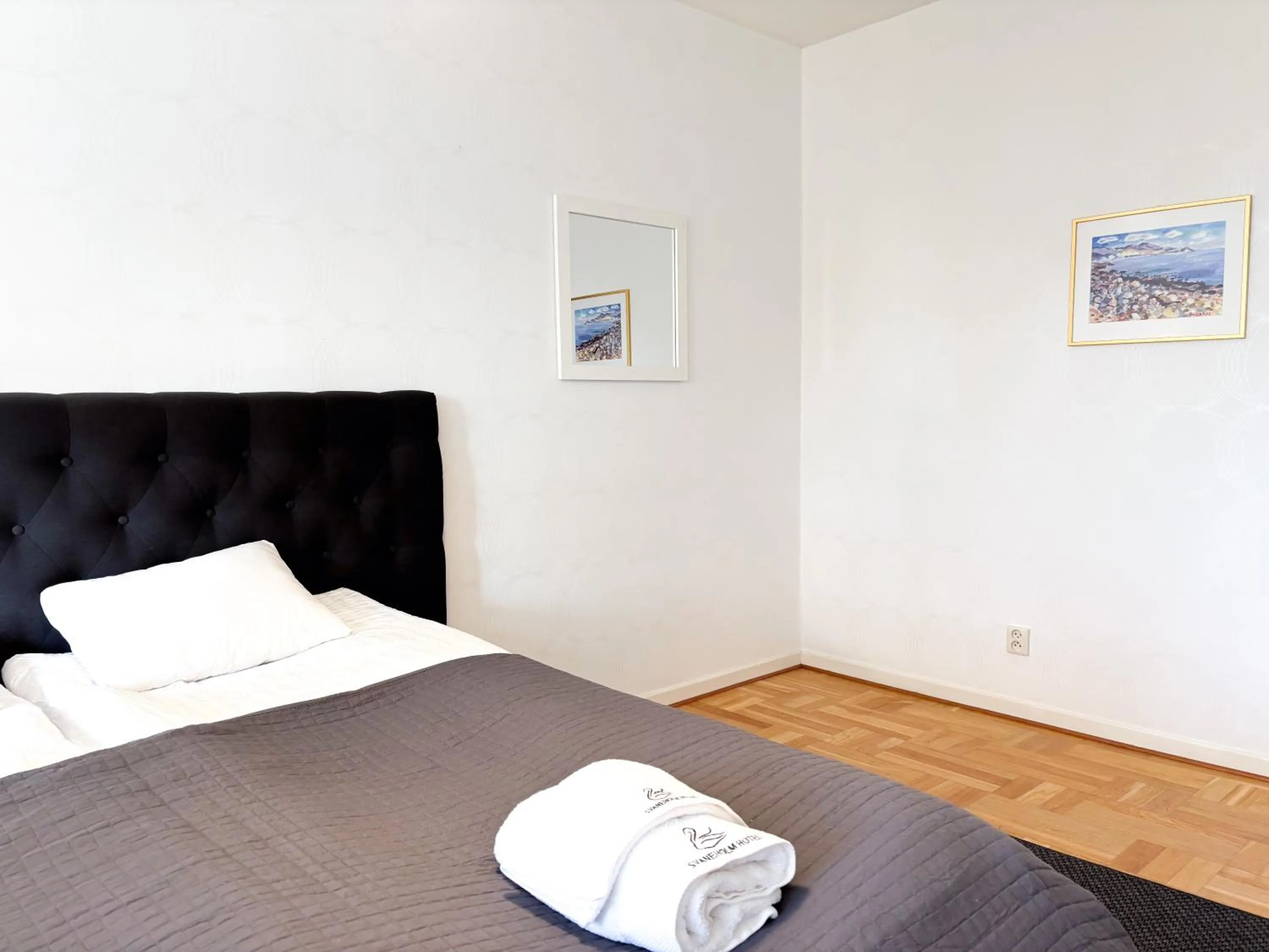 Bed in Säffle Suites by Svaneholm Hotel