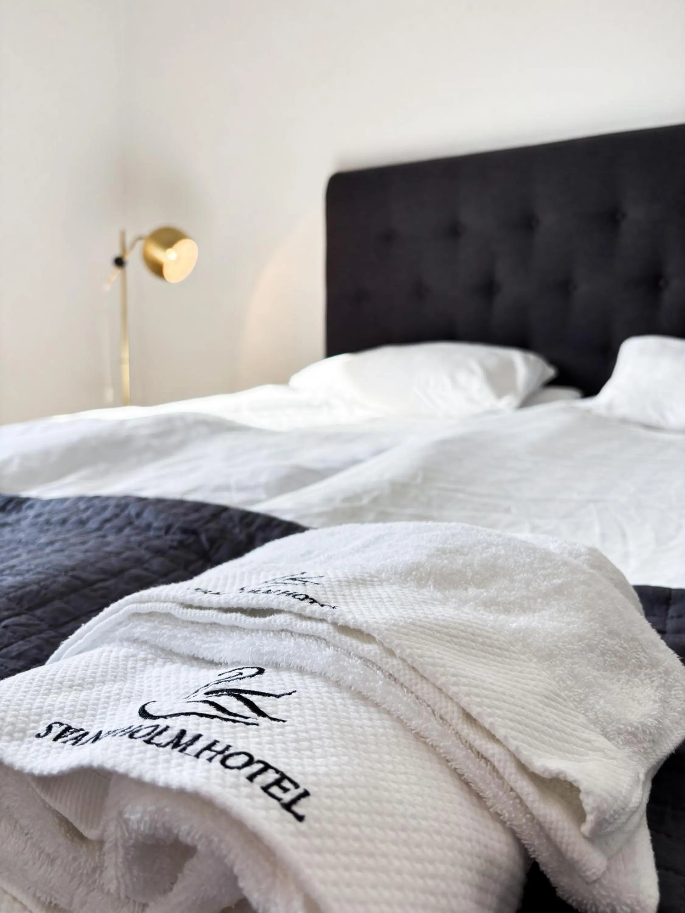 Bed in Säffle Suites by Svaneholm Hotel