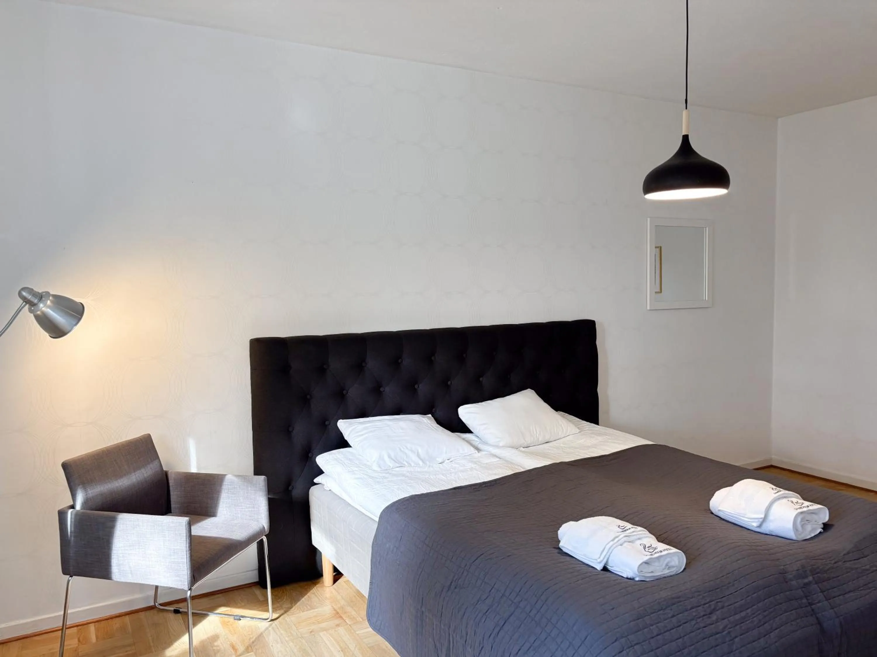 Bed in Säffle Suites by Svaneholm Hotel