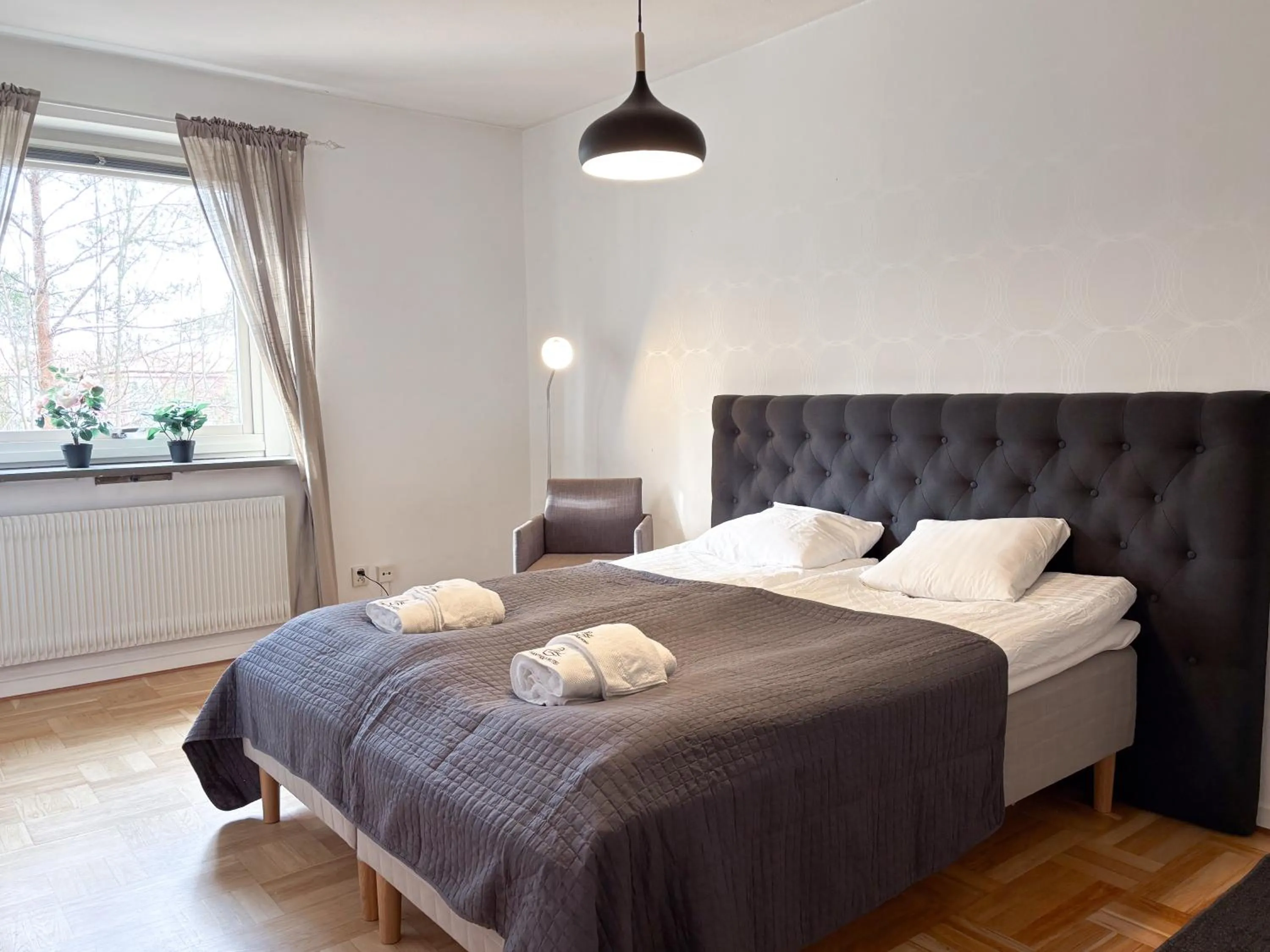 Bed in Säffle Suites by Svaneholm Hotel