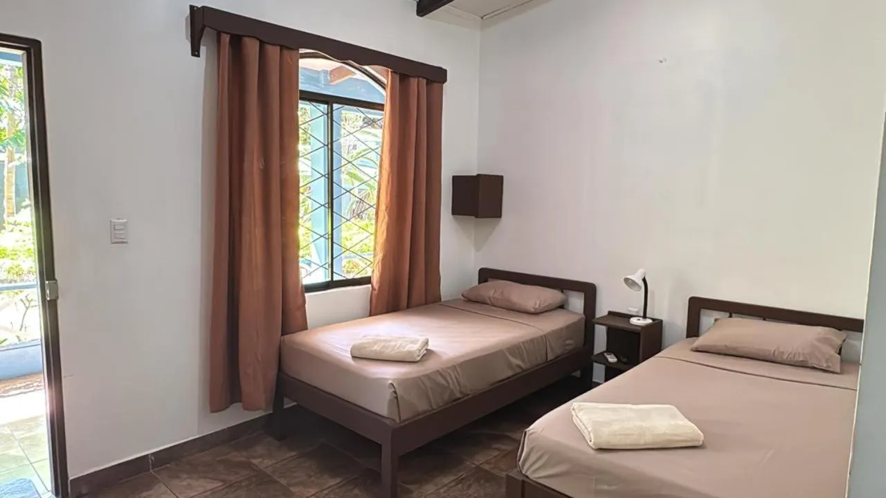 Bed in Hotel Marielos Tamarindo