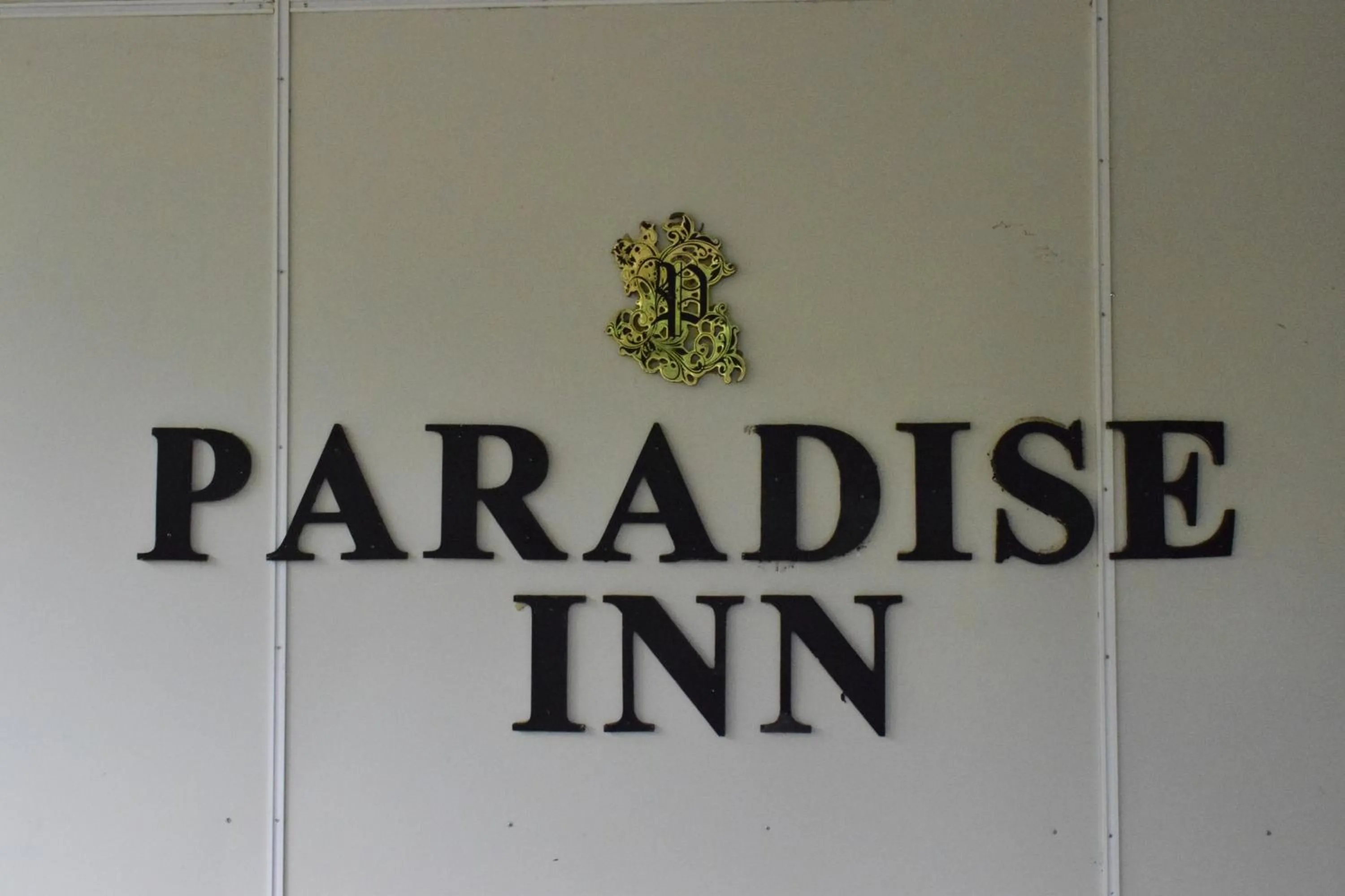 Property logo or sign in Paradise Inn