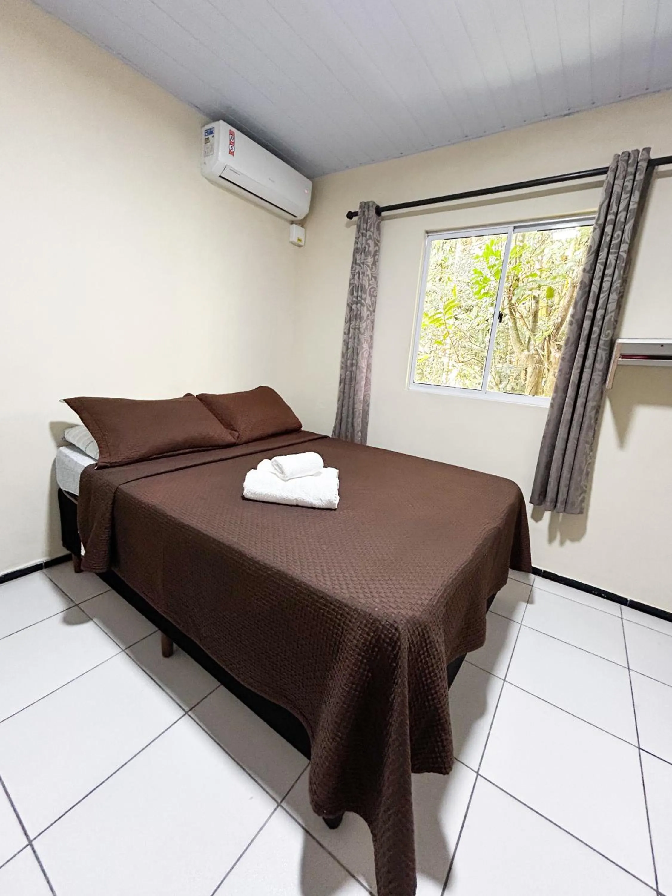 Bed in Pousada Toca da Ilha