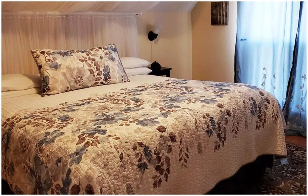 Bed in Cabernet House, an Old World Inn