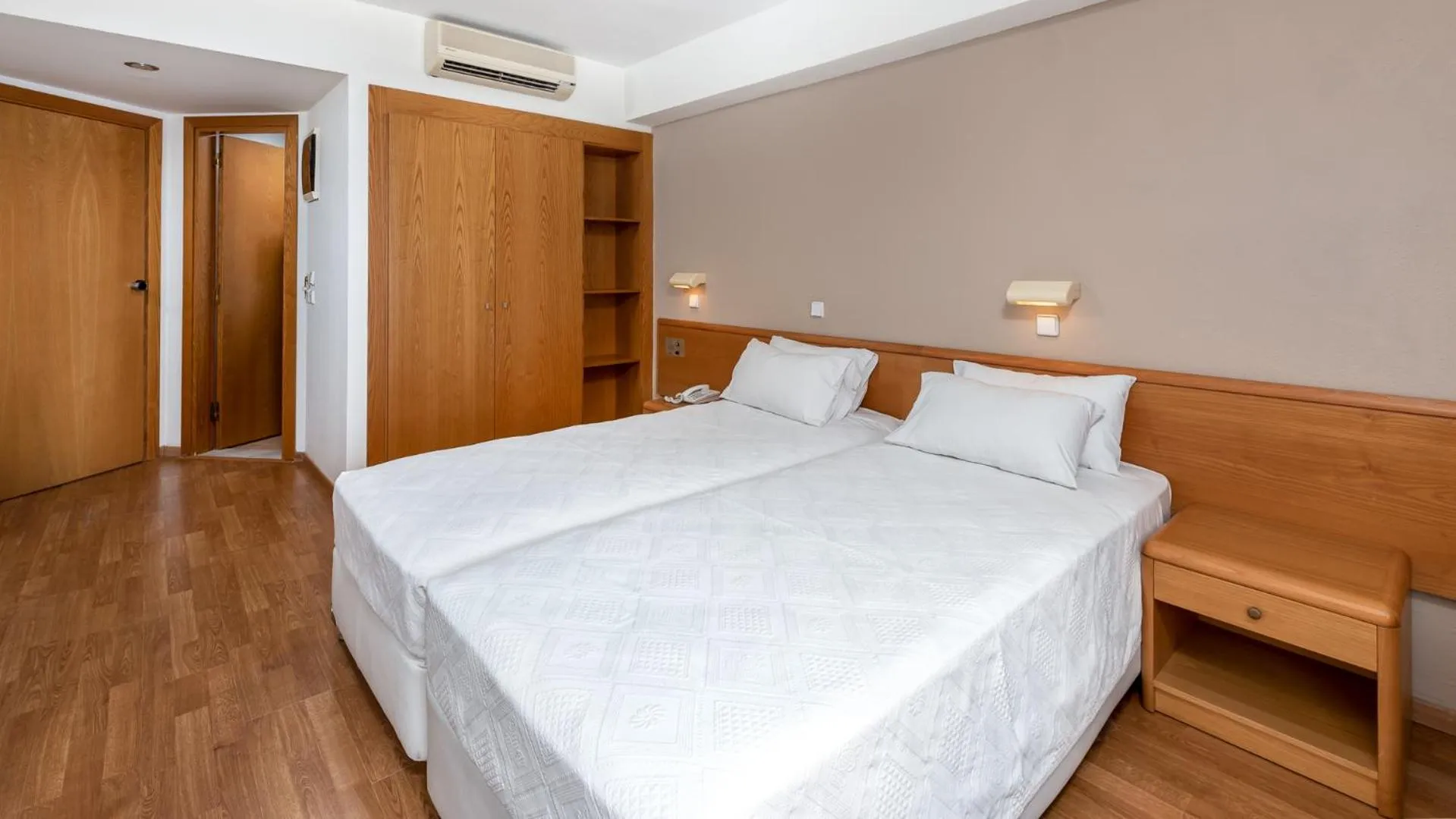 Bed in Sirene Beach Hotel