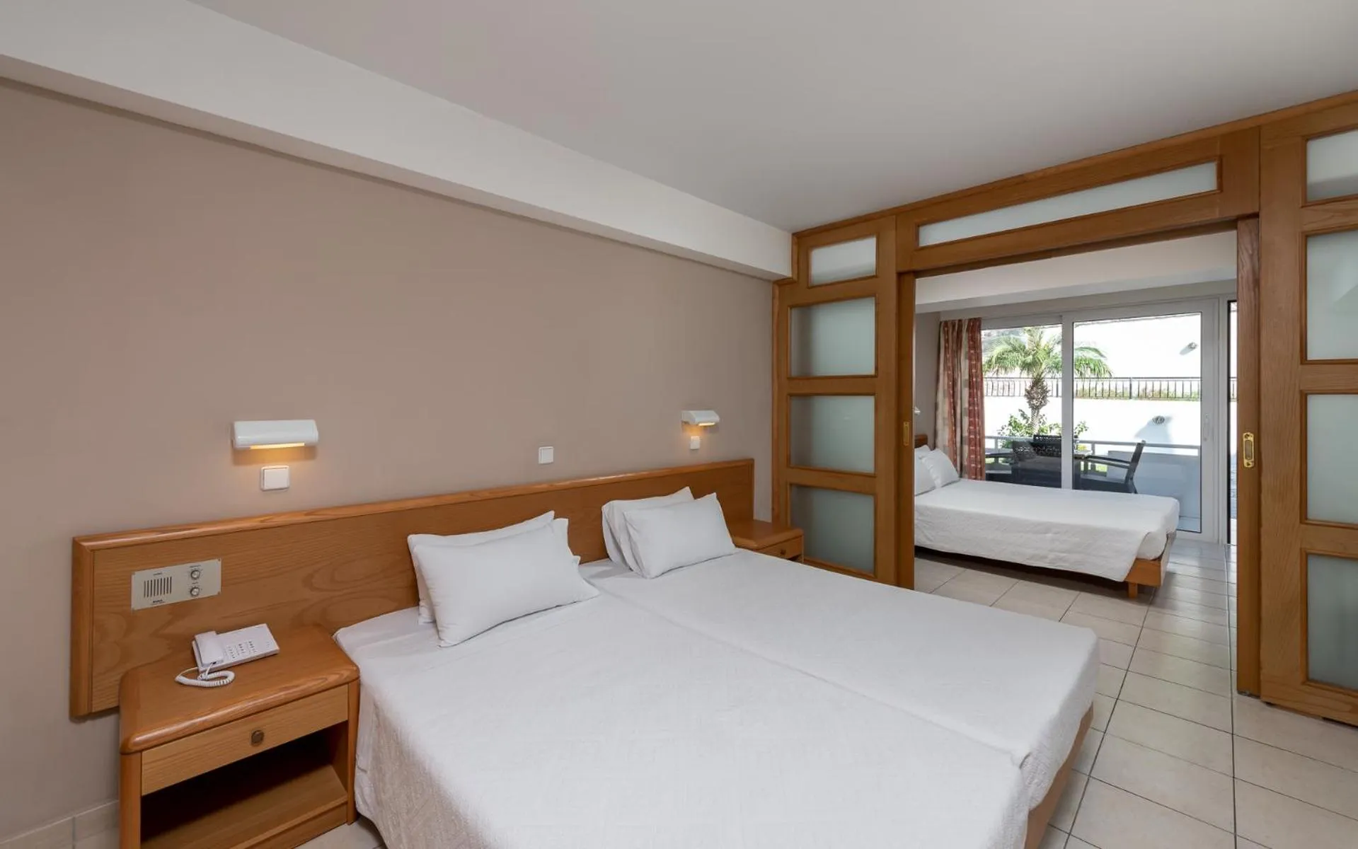 Bed in Sirene Beach Hotel