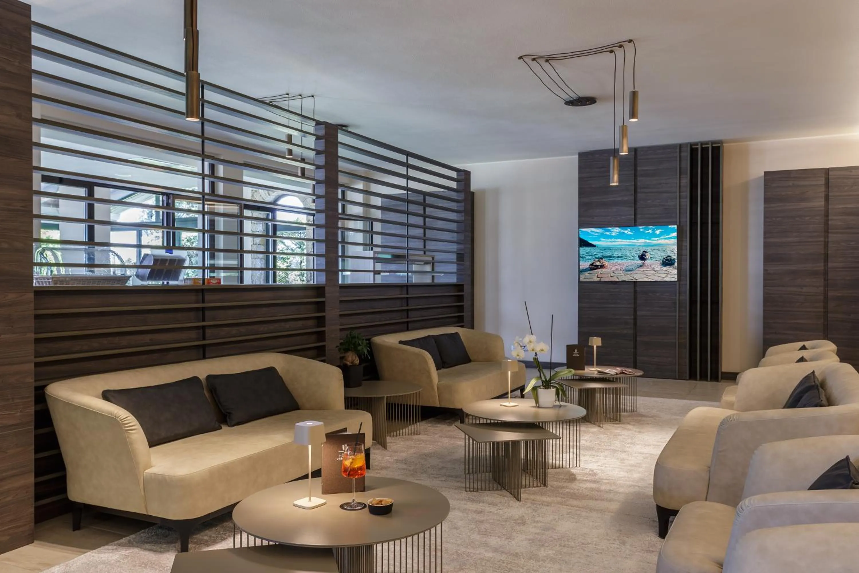 Communal lounge/ TV room in Hotel Veronesi