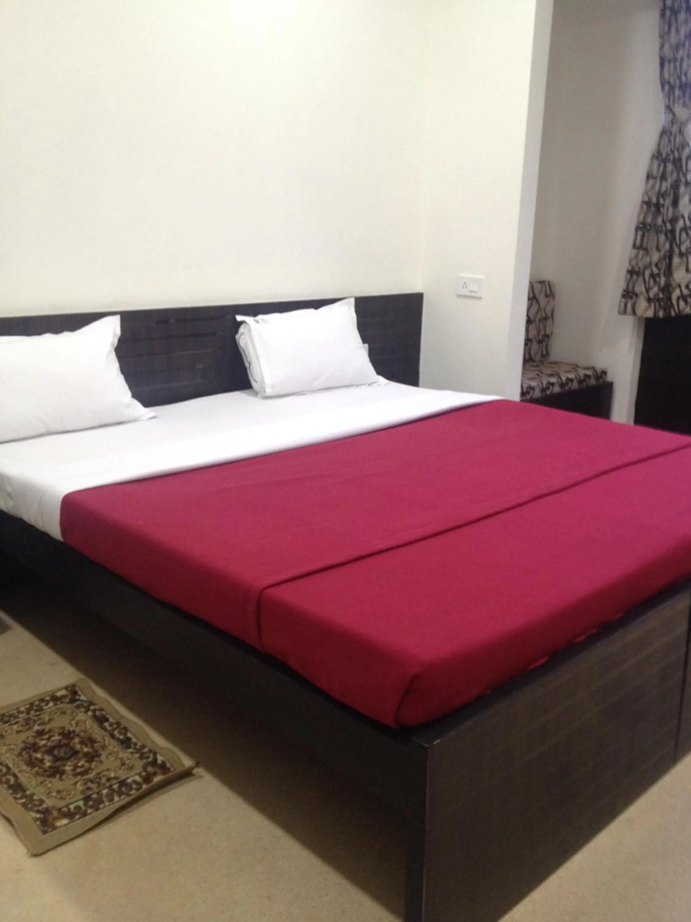 Bed in Hotel Nest International