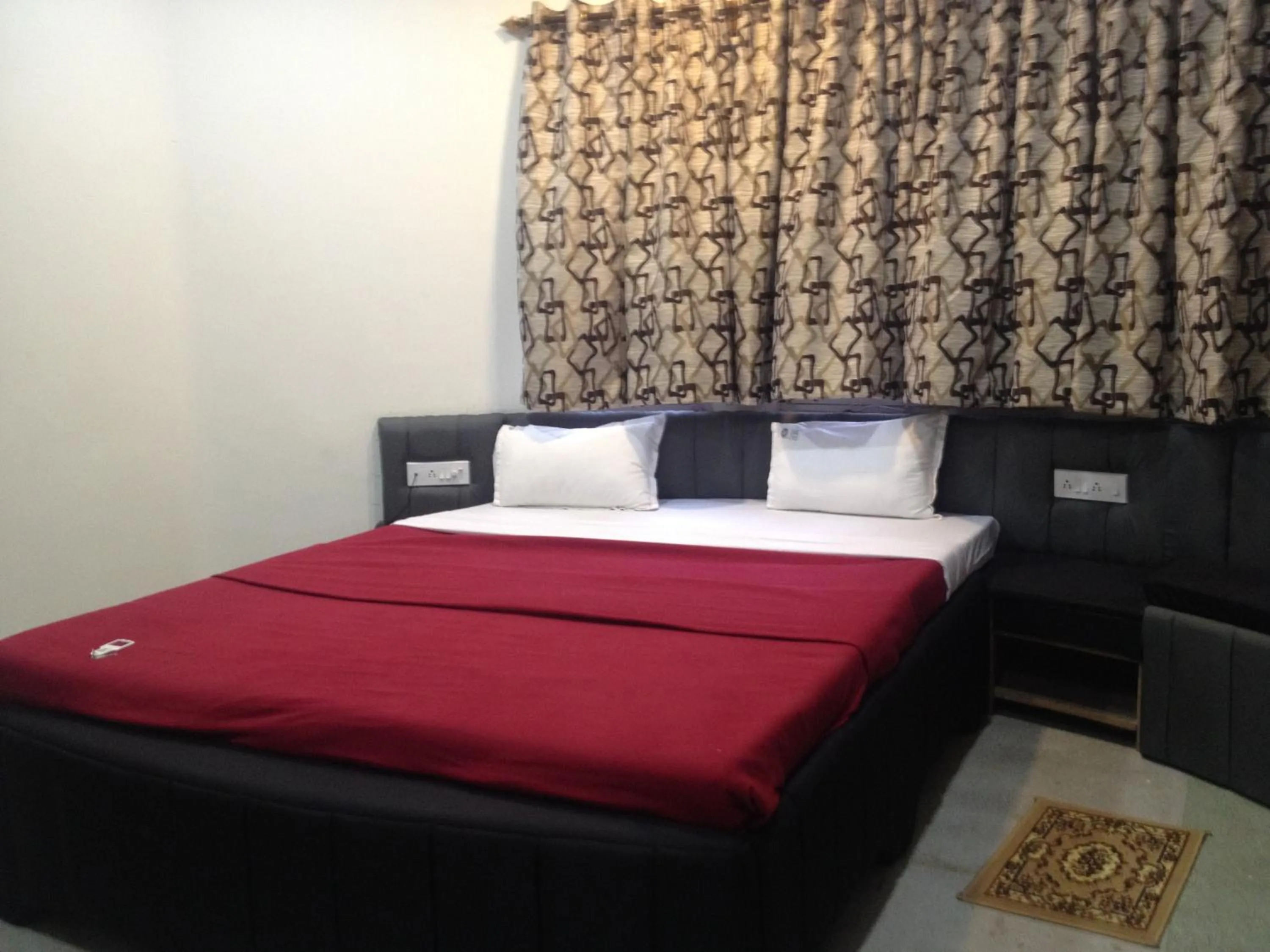 Bed in Hotel Nest International