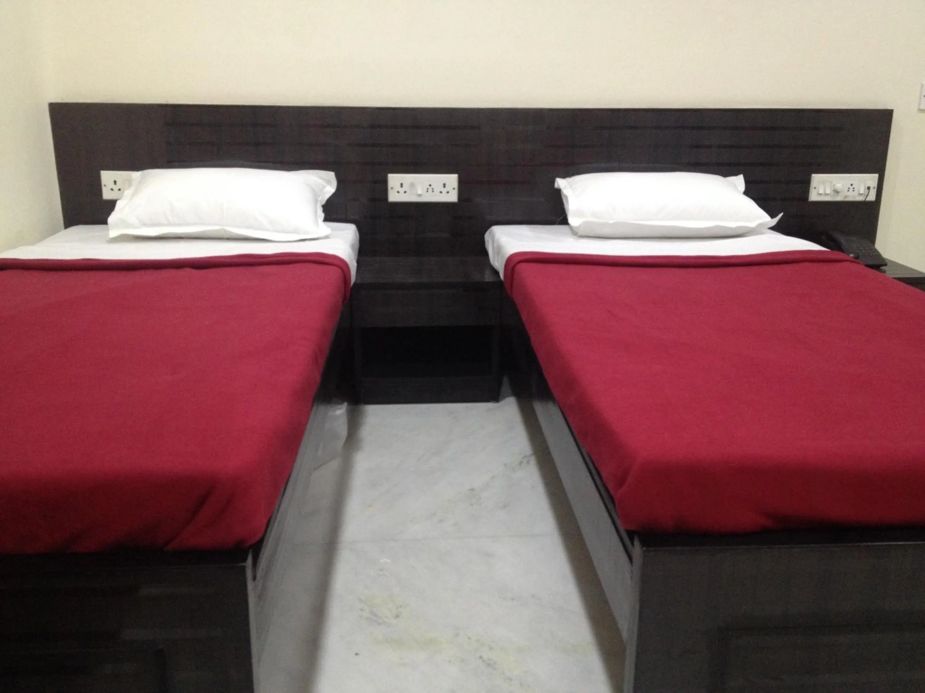 Bed in Hotel Nest International