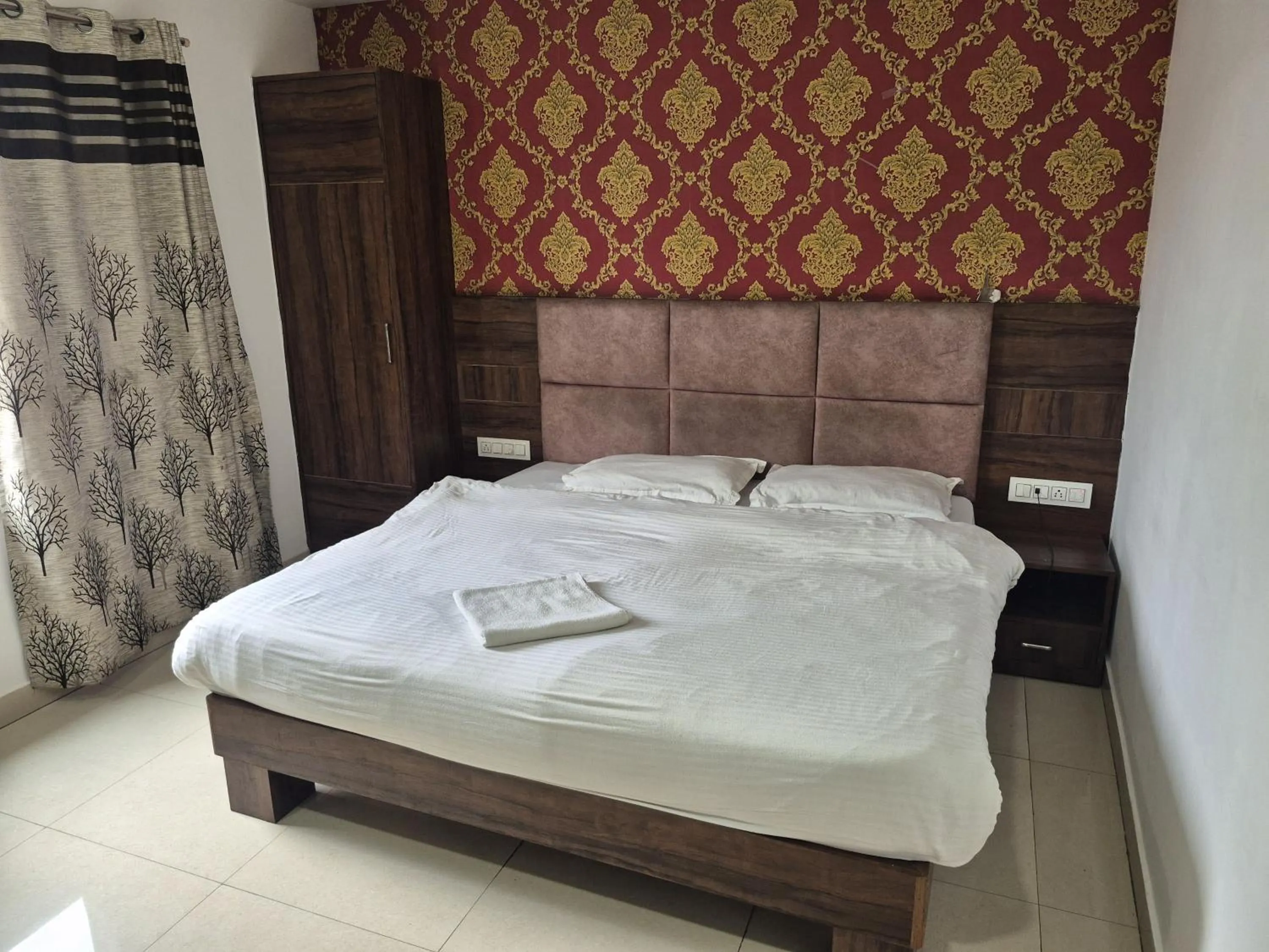 Photo of the whole room, Bed in JK Residency