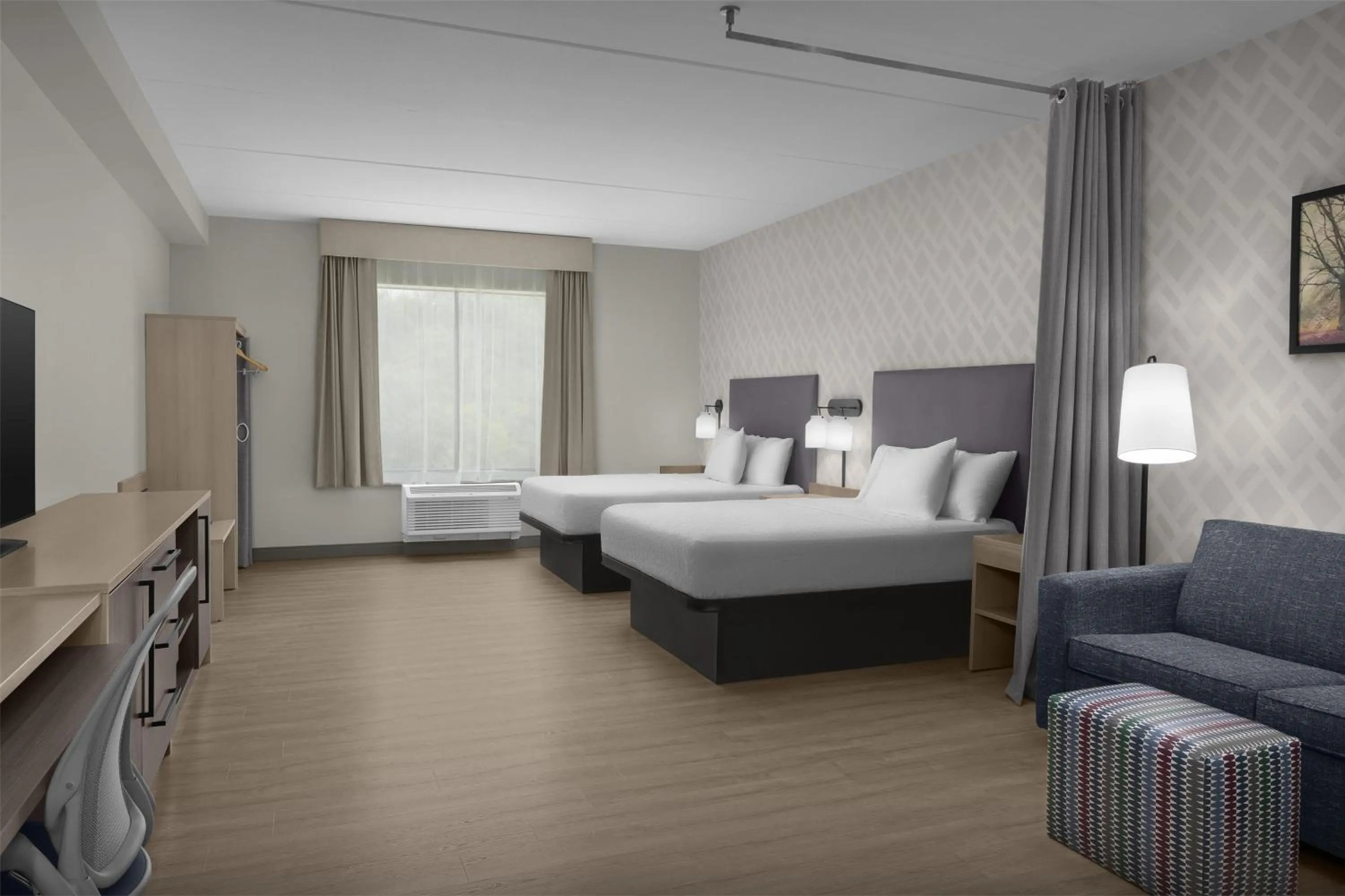 Living room, Bed in Home2 Suites By Hilton Sevierville