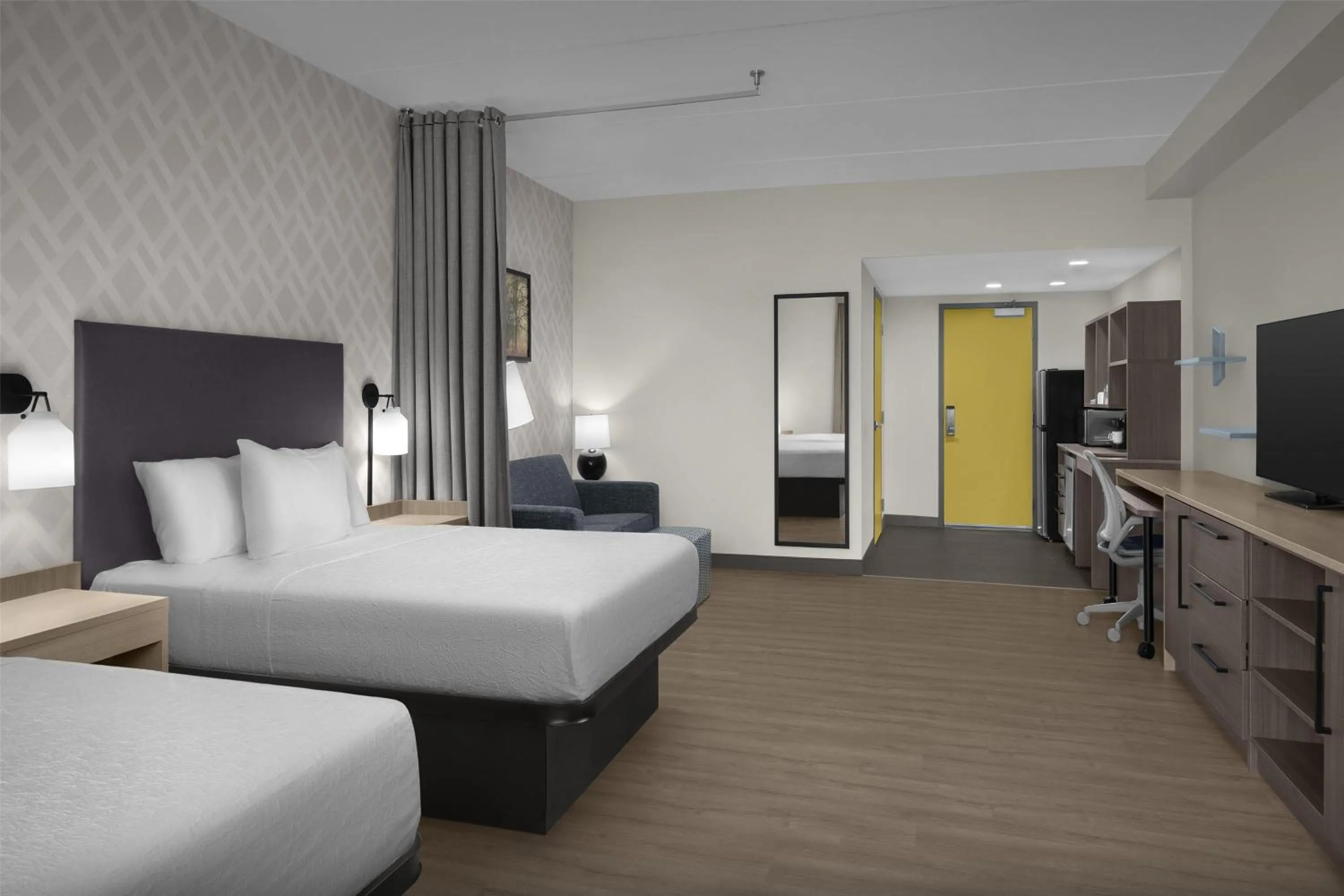 Living room, Bed in Home2 Suites By Hilton Sevierville