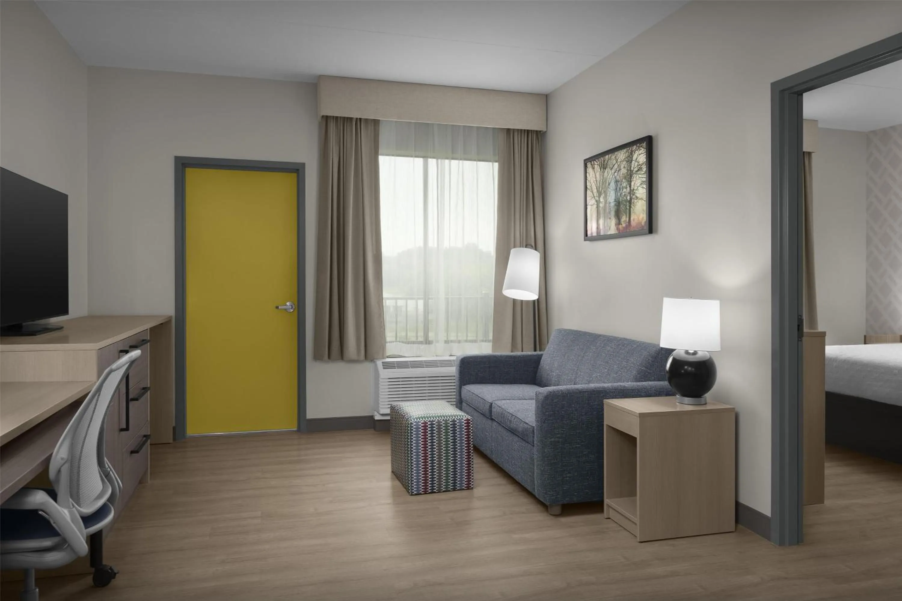 Living room, Bed in Home2 Suites By Hilton Sevierville