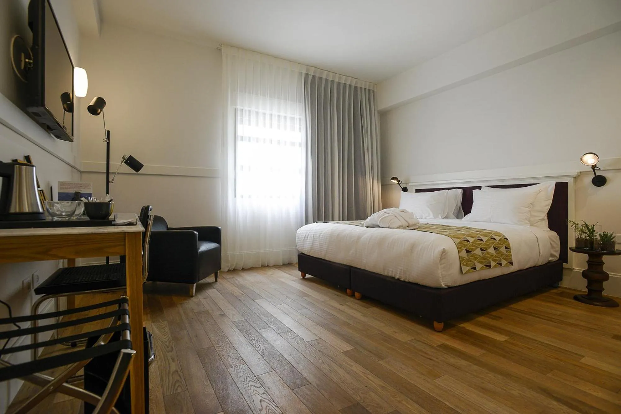 Bed in Lily & Bloom Boutique Hotel