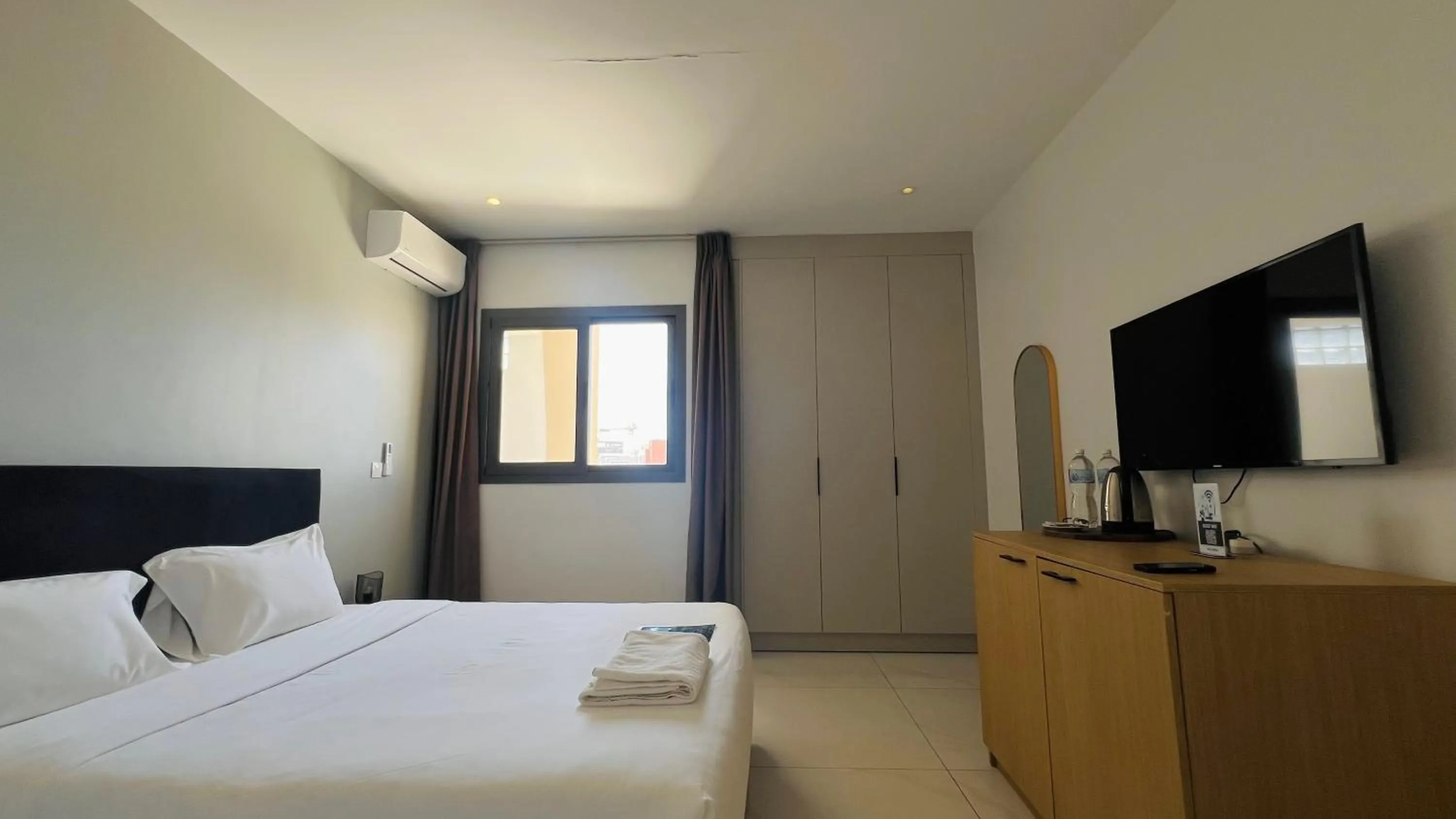 Bed in AfricaWorks Suites