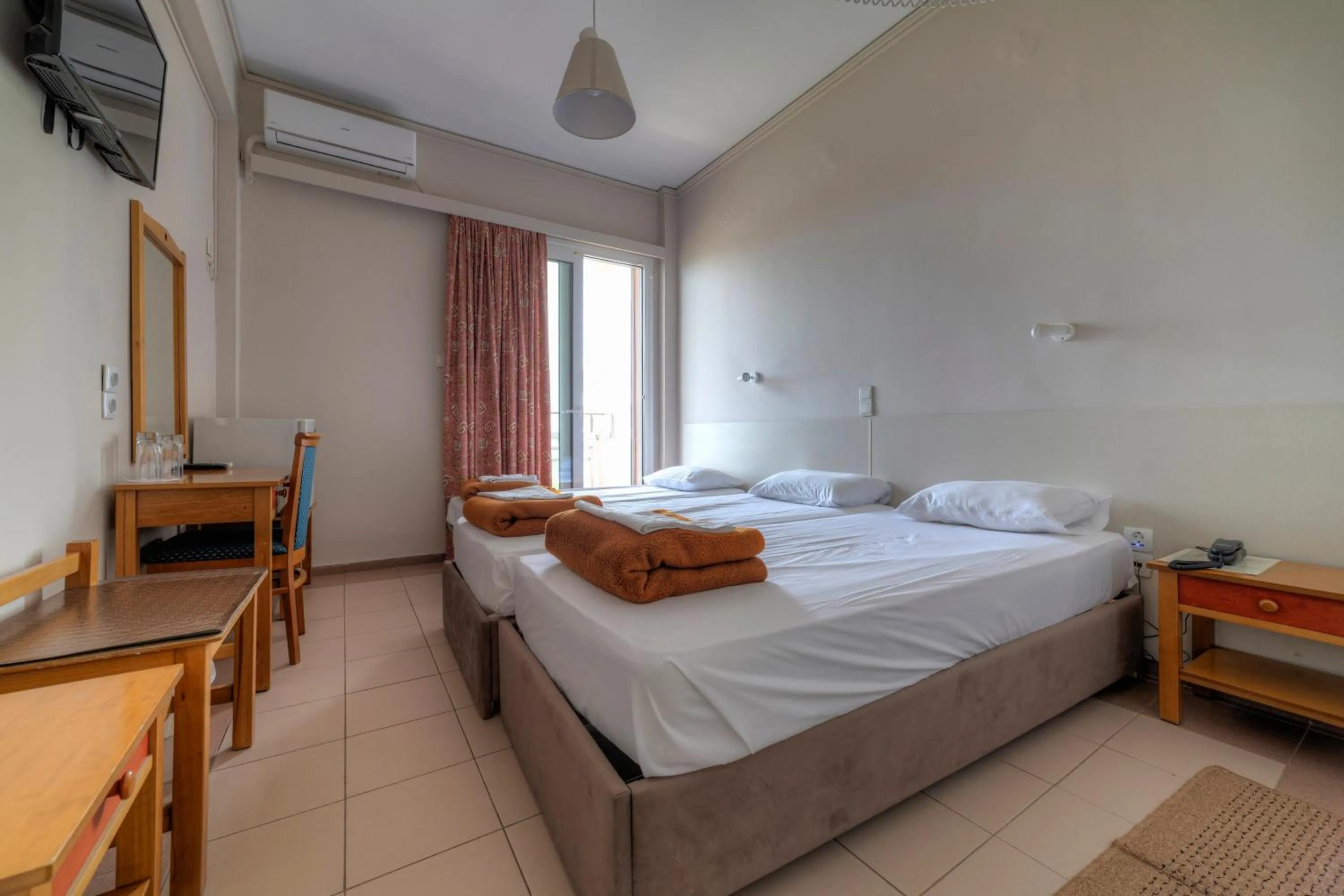 Bed in Delfini Hotel