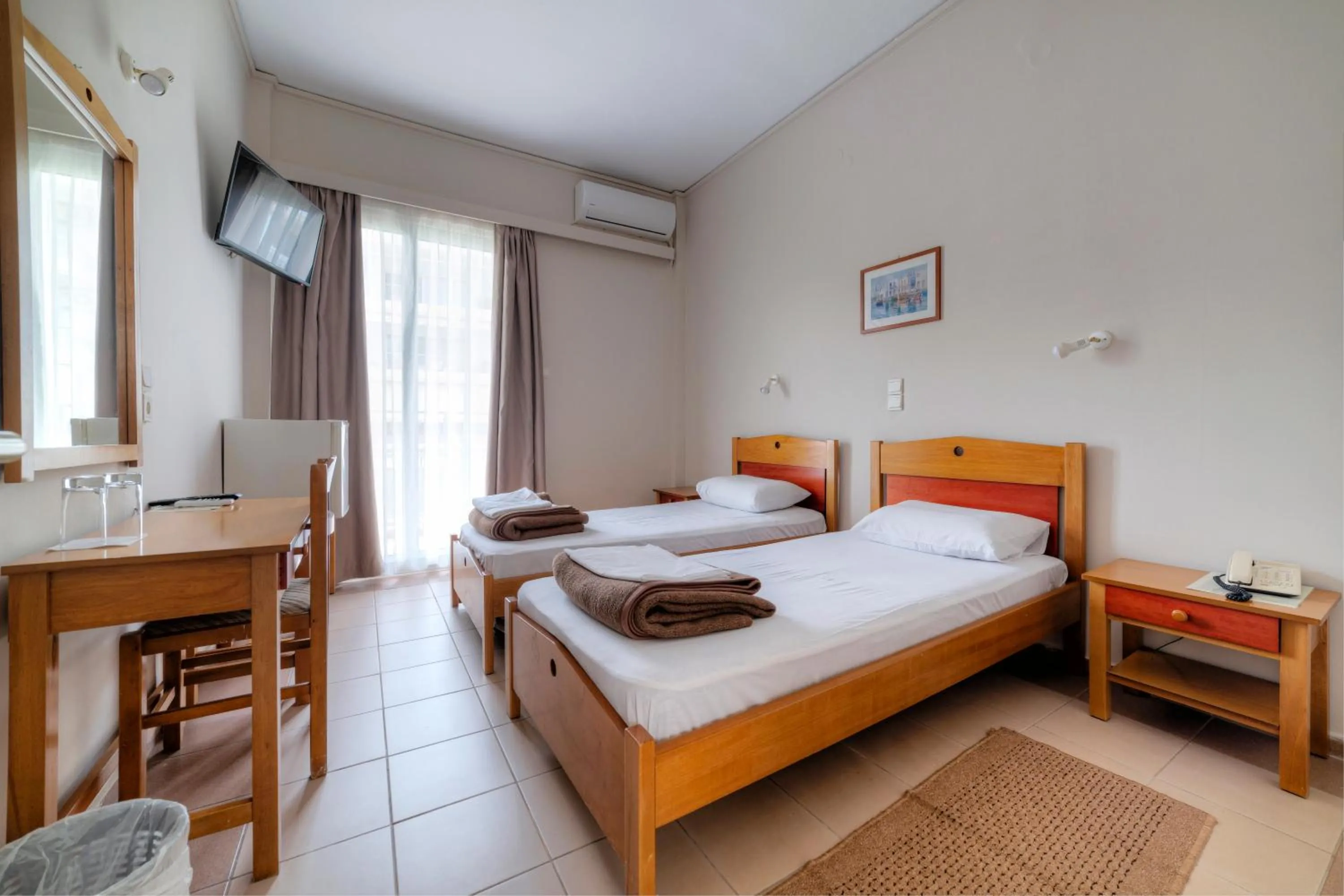 Bed in Delfini Hotel