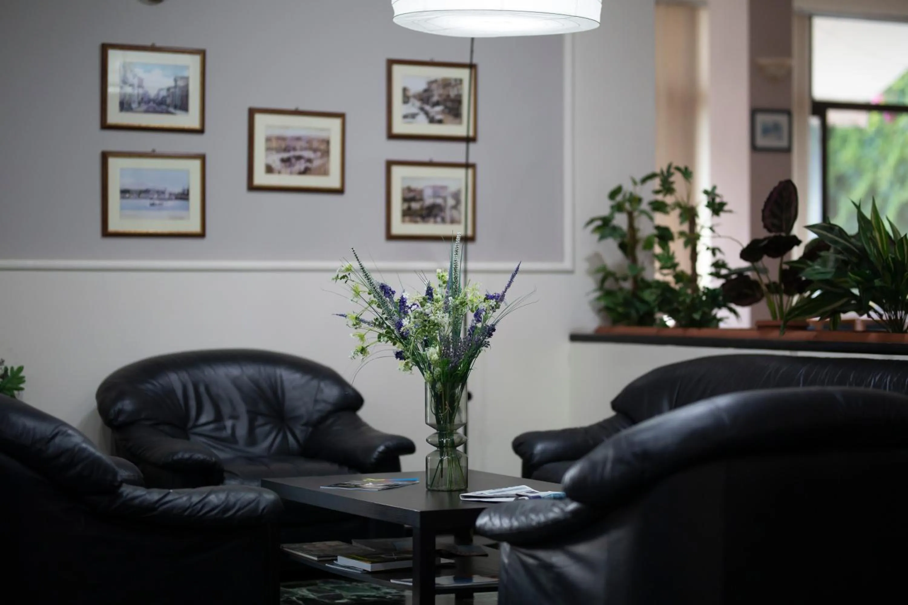 Communal lounge/ TV room in Delfini Hotel