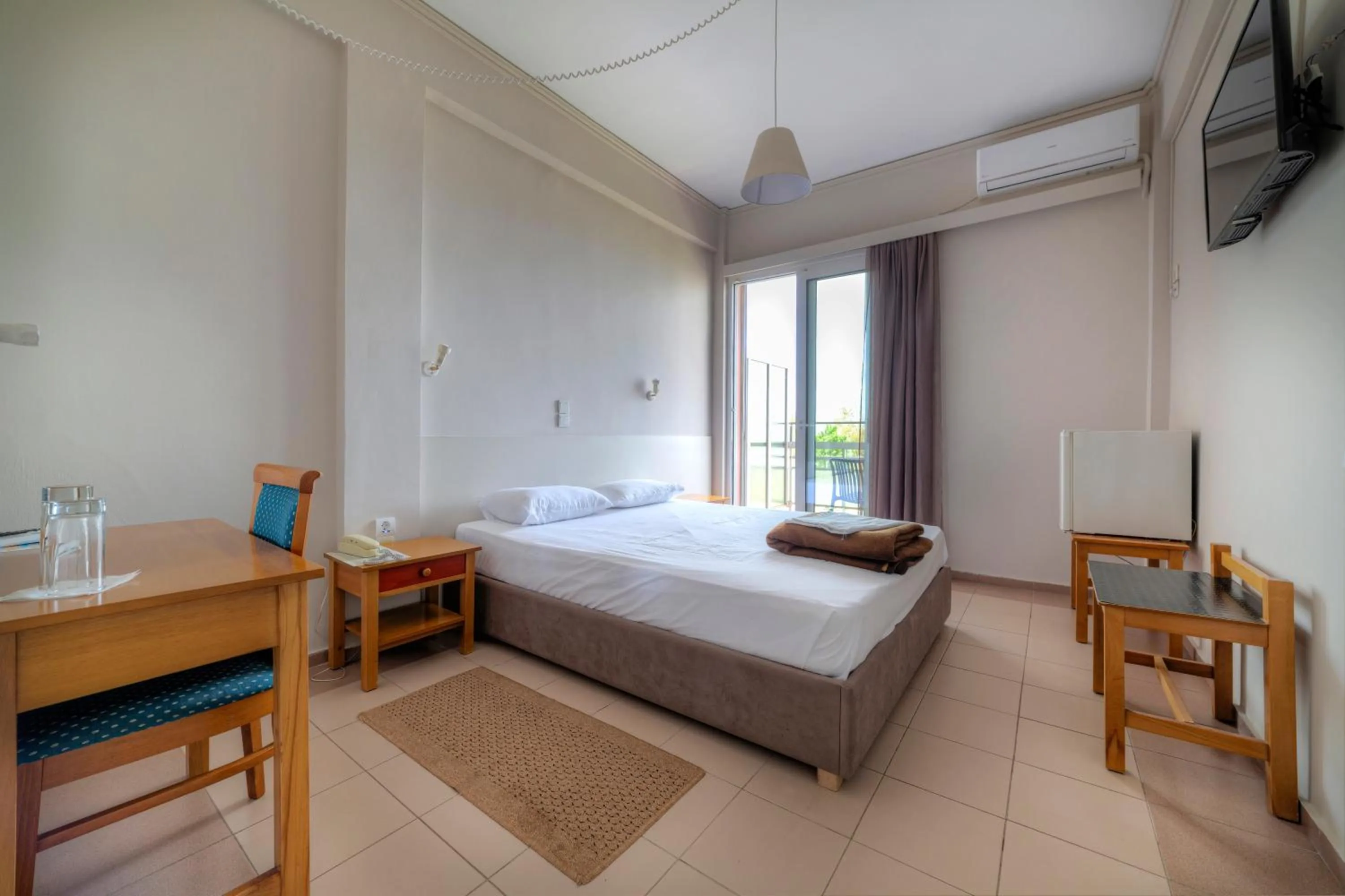 Bed in Delfini Hotel