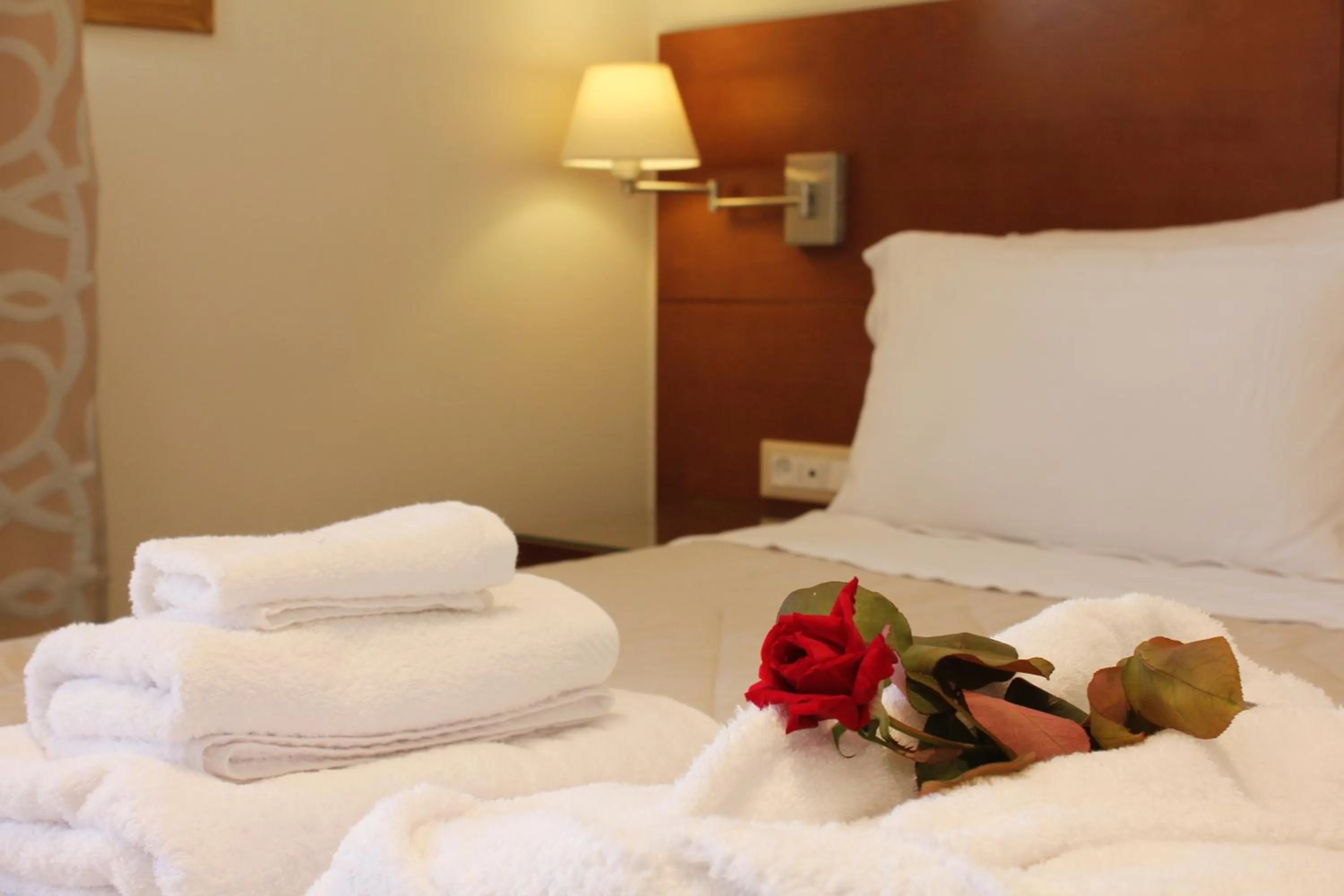 Bed in Niriides Luxury Villas