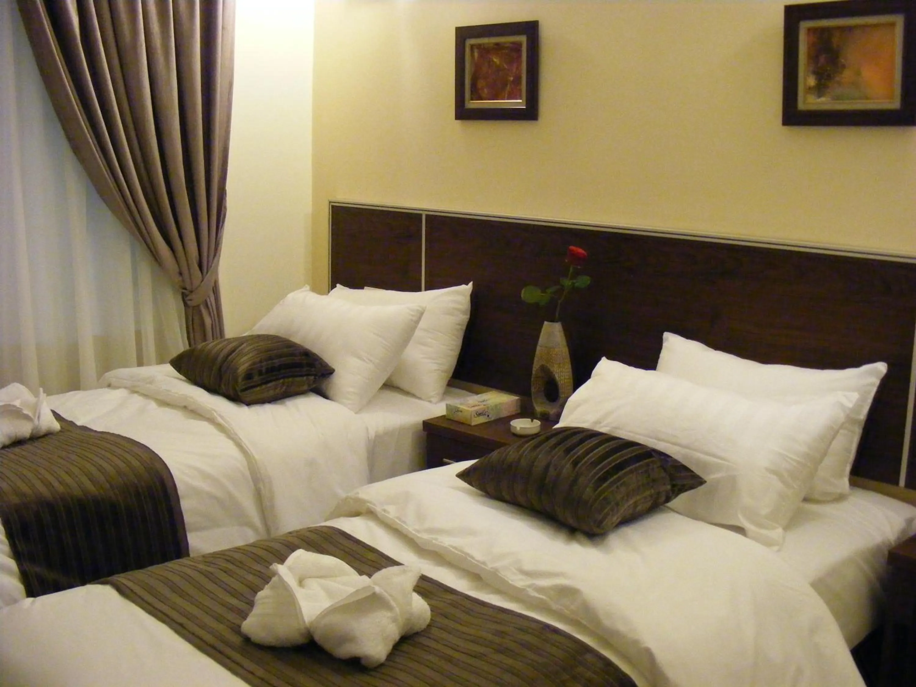 Bed in Ream Hotel Amman