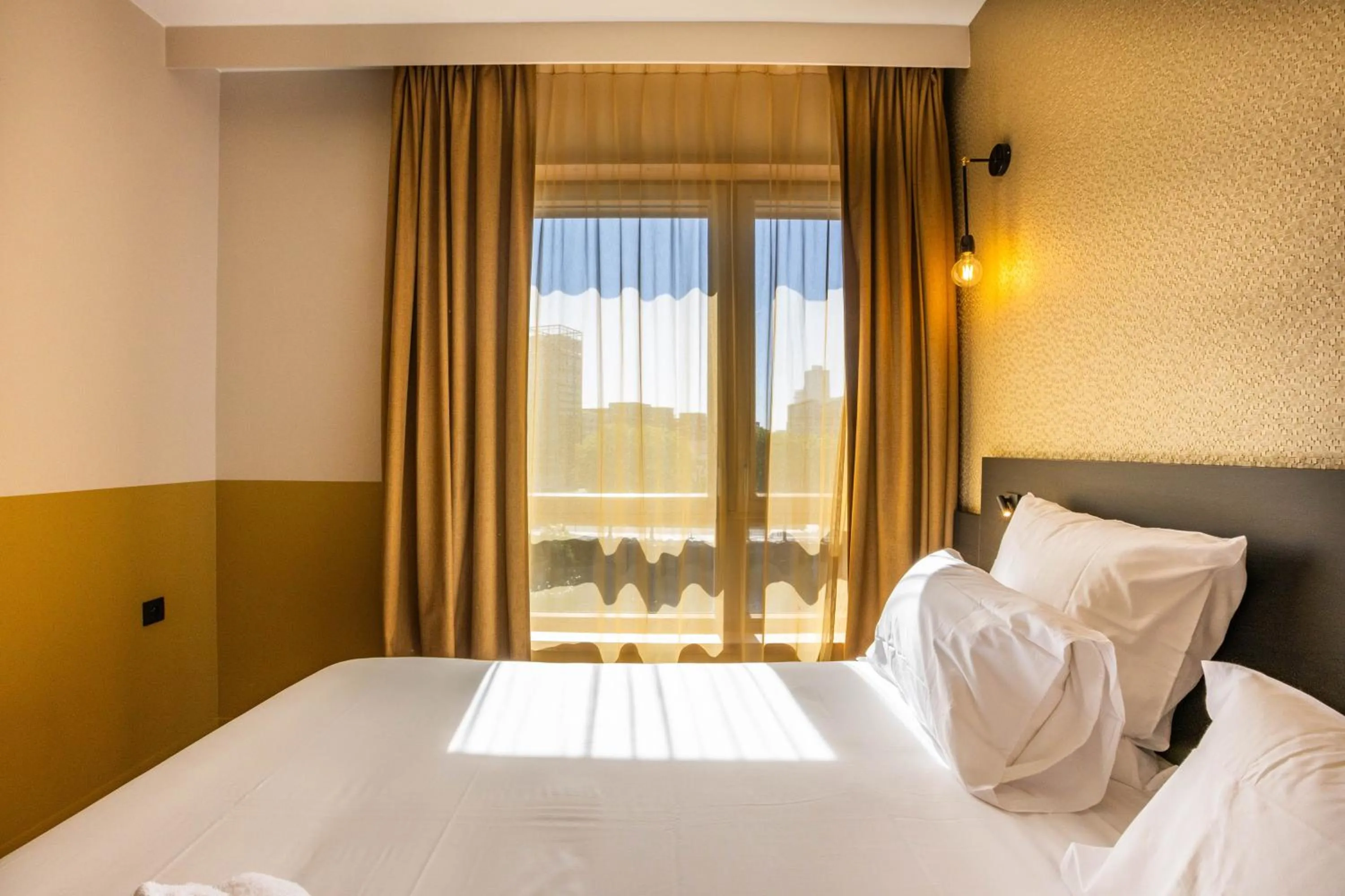 Bed in All Suites Hôtel - Paris Pleyel - L'Île Saint Denis