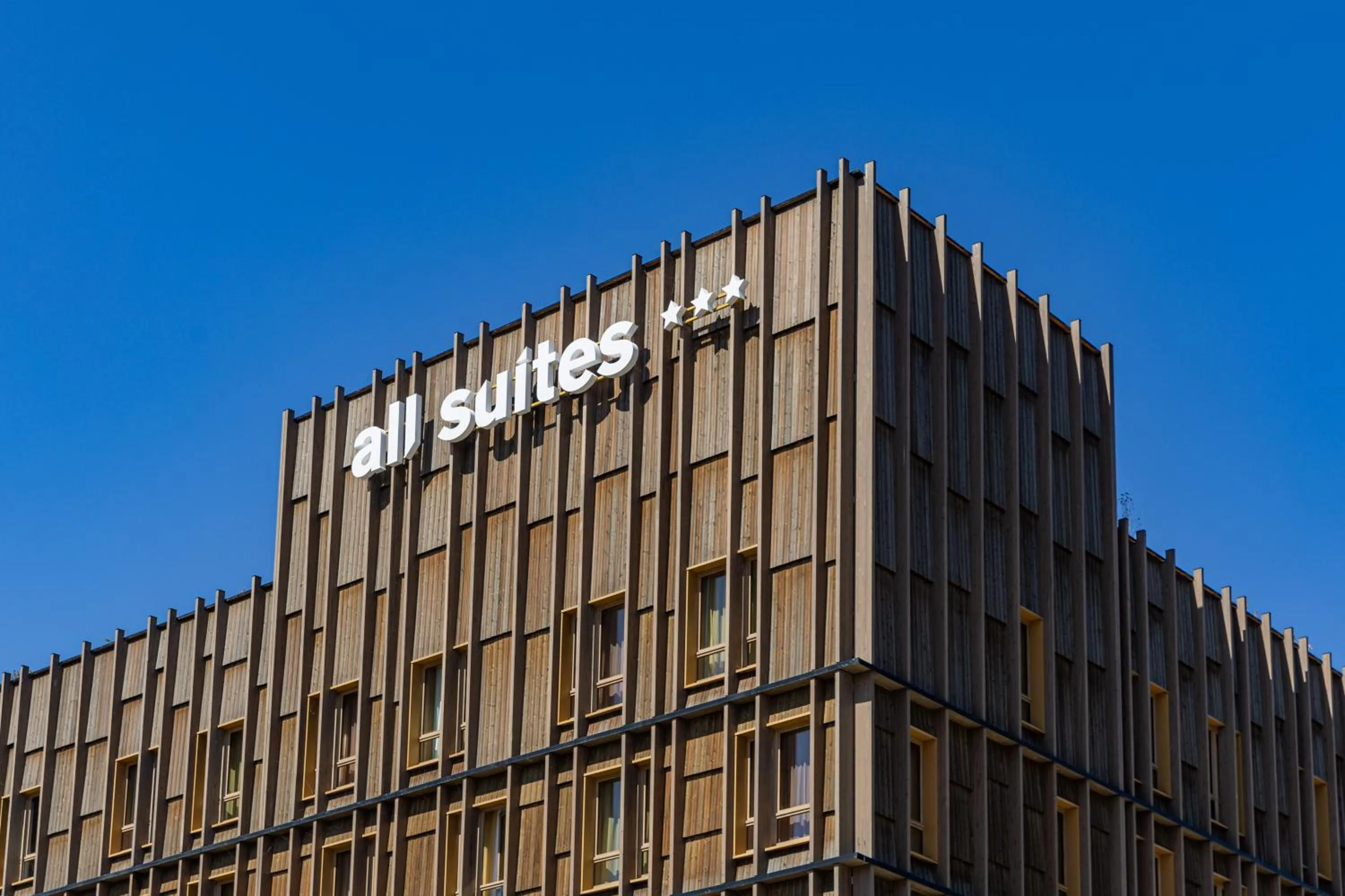 Property building in All Suites Hôtel - Paris Pleyel - L'Île Saint Denis