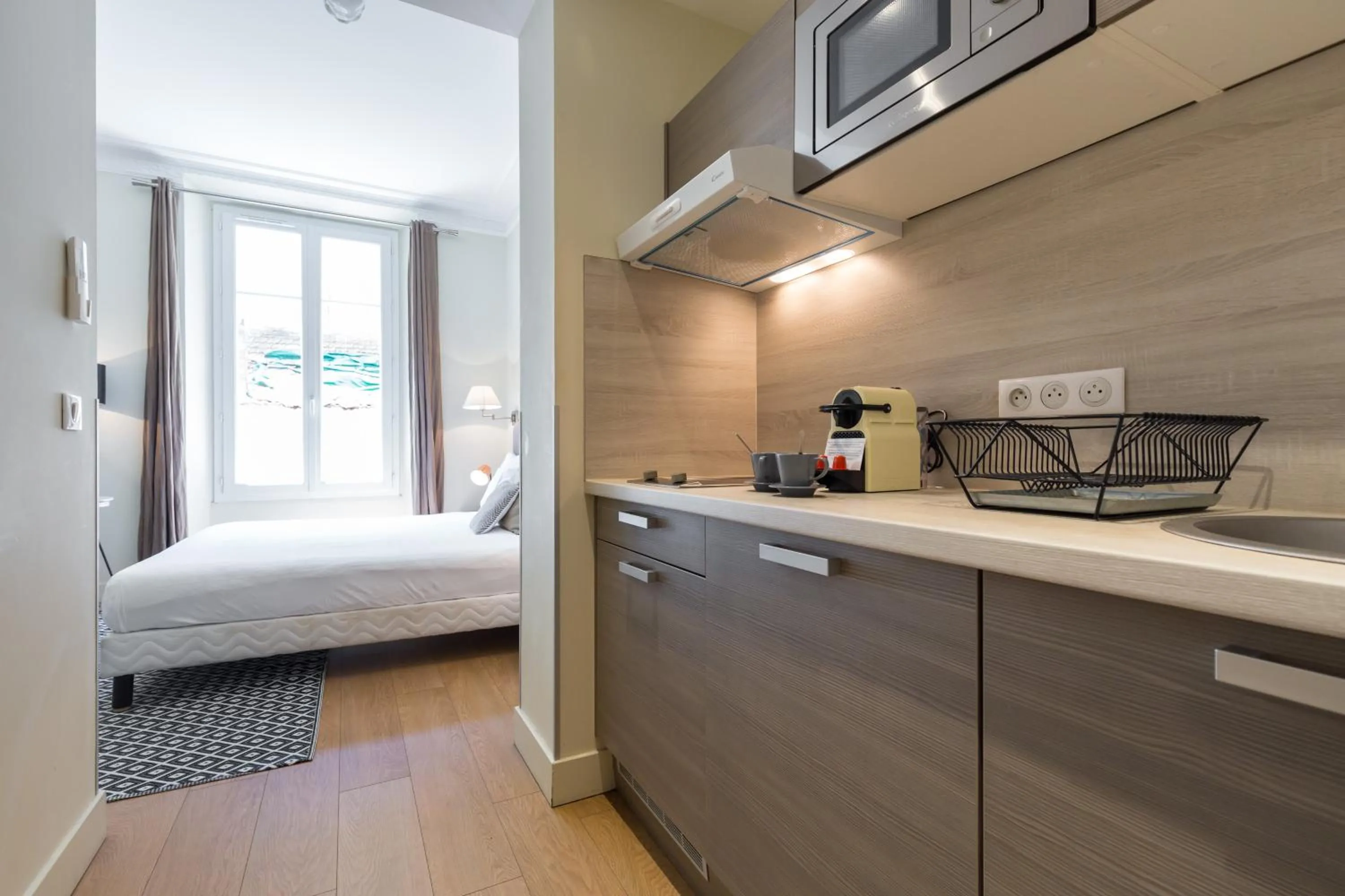 Kitchen or kitchenette, Bed in Florella Jean Jaures Apartment