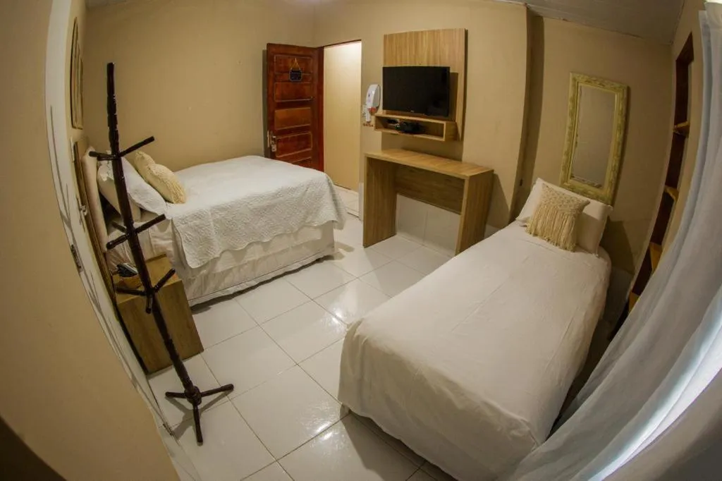 Bed in Pousada da Leide