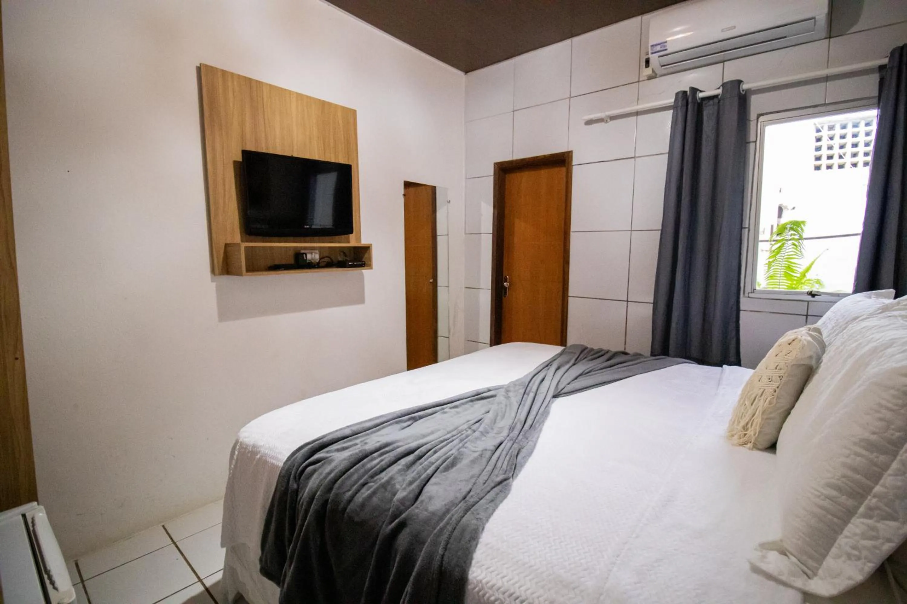 Bed in Pousada da Leide