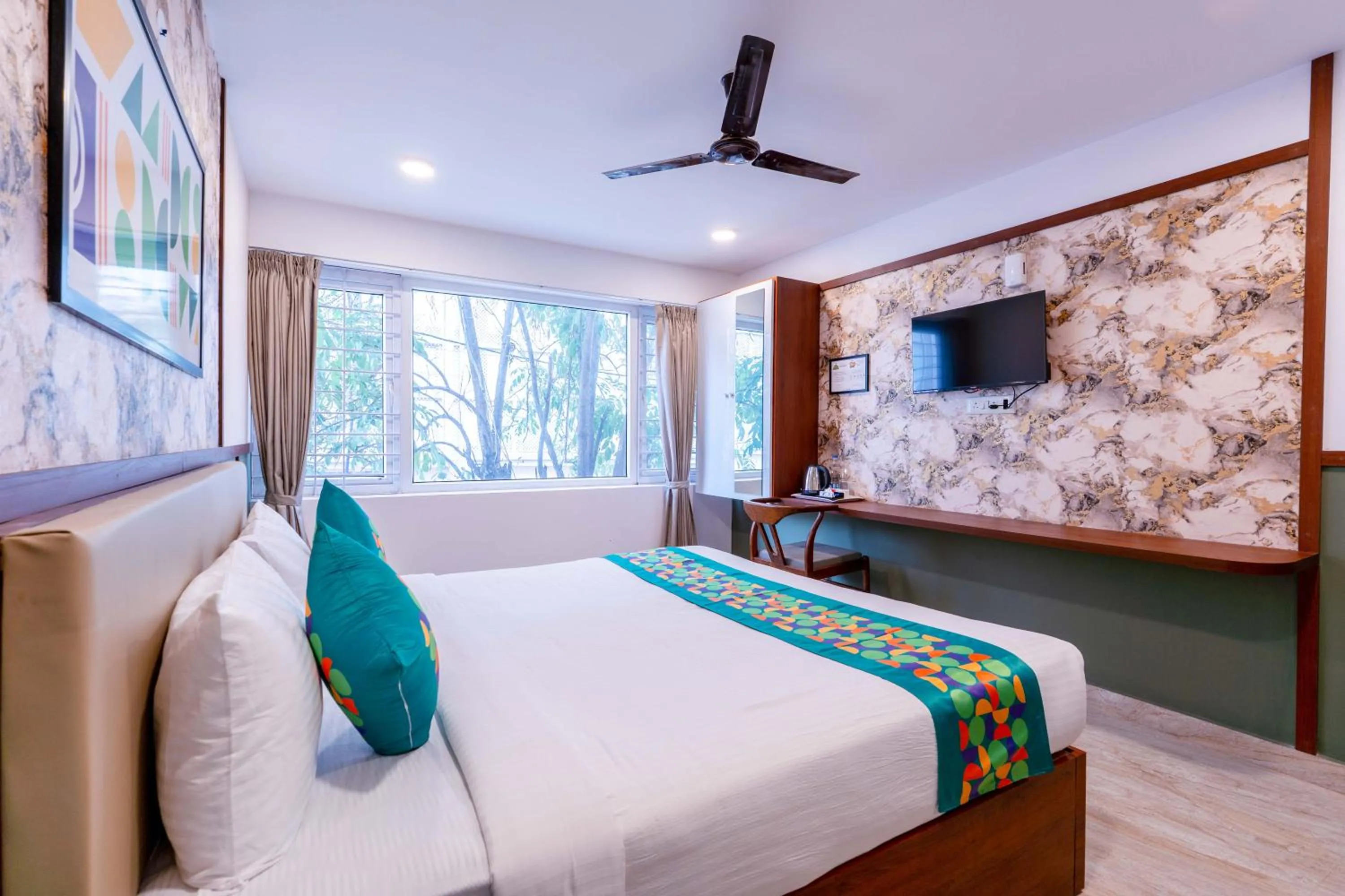 Bedroom, Bed in Treebo Emirates Suites Indiranagar