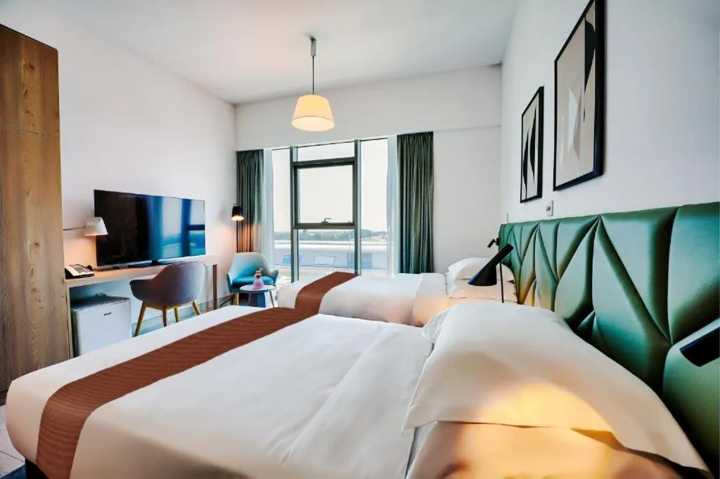 Bed in Capital Suites Hotel Apartments