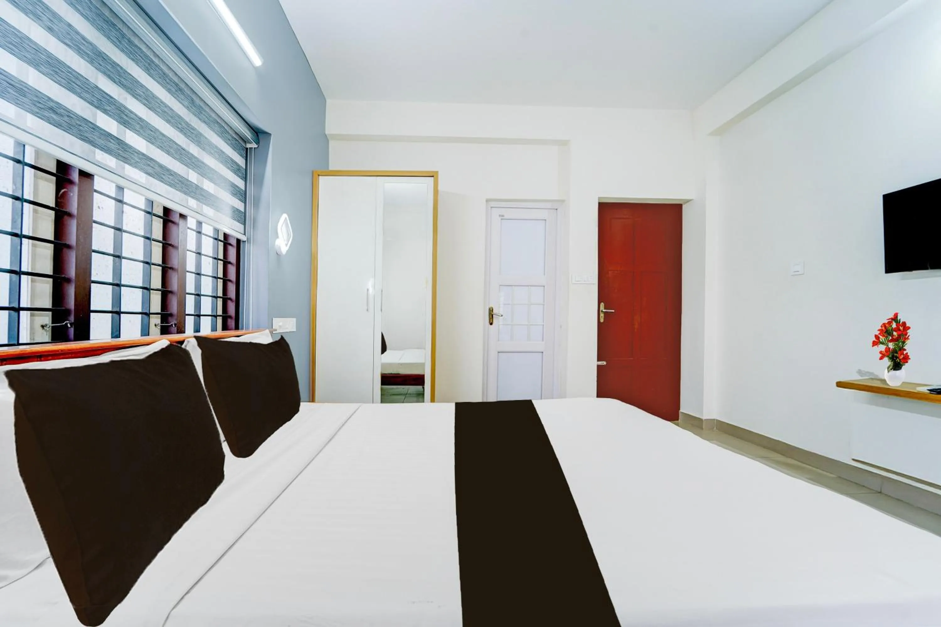Bedroom, Bed in Super Hotel O Kazhakootam Near Technopark Phase 2